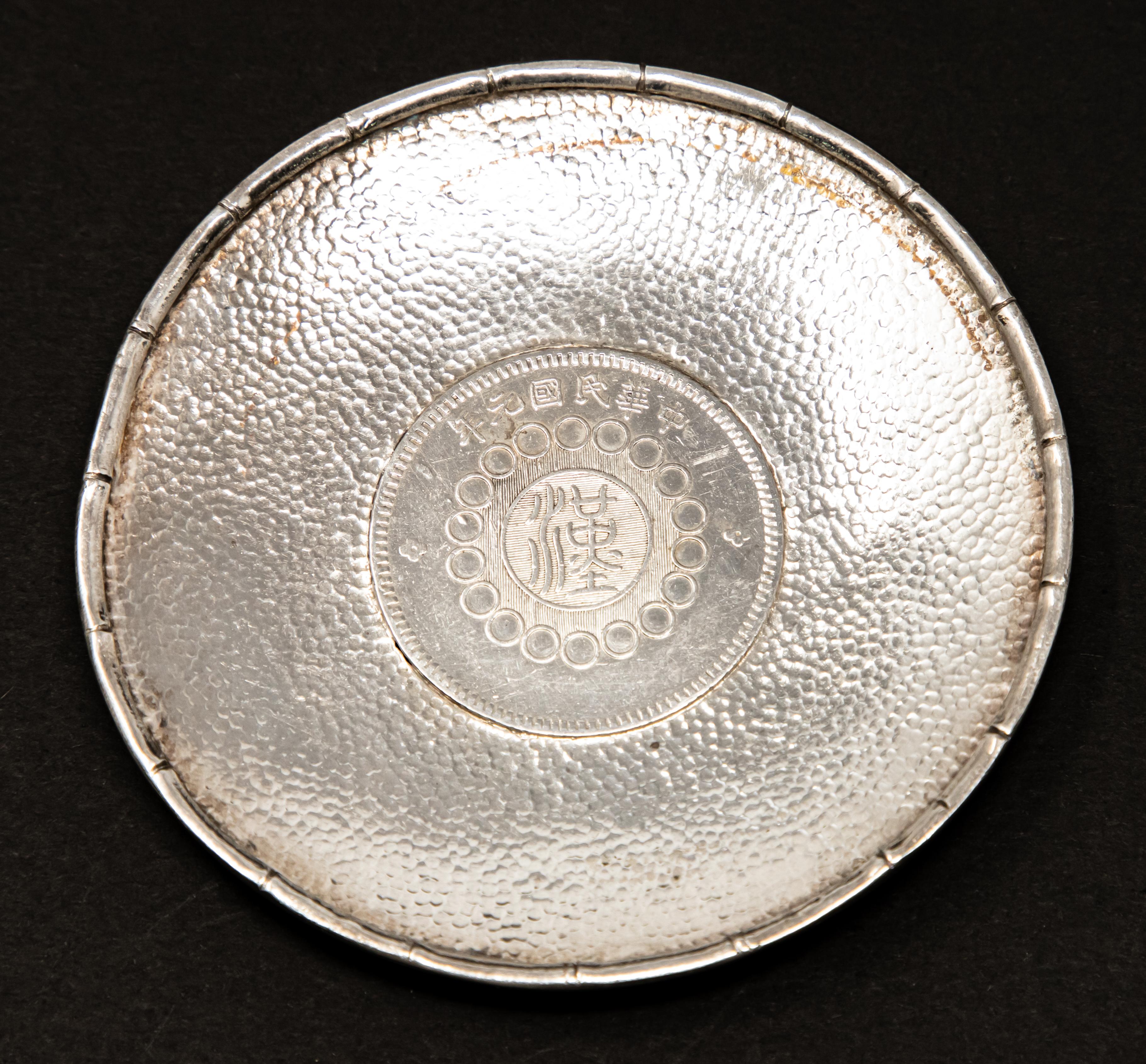 Offering this sterling silver Chinese coin dish. The coin is marked on both sides with Chinese markings.