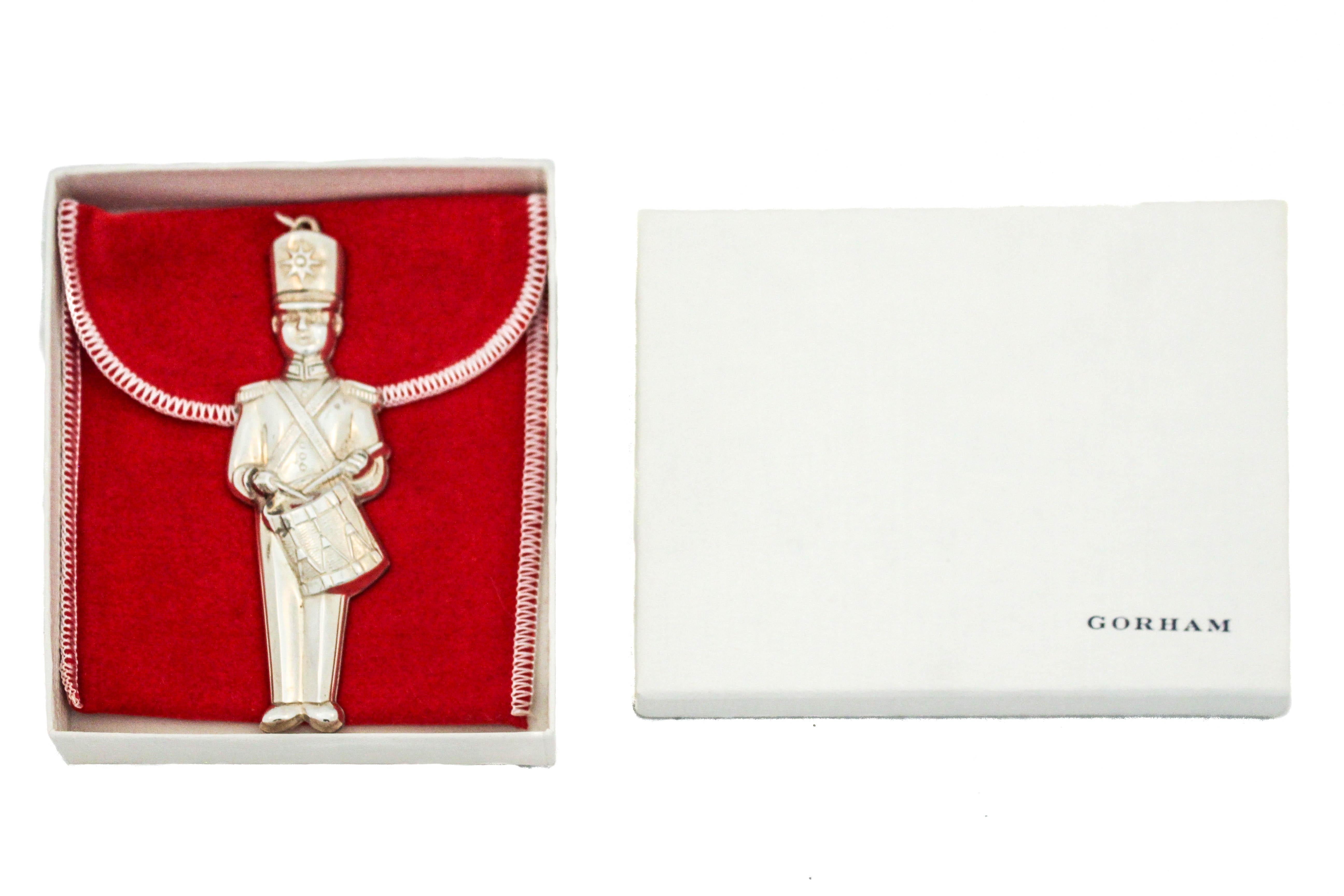 Being offered is a sterling silver Christmas ornament made by Gorham Silversmiths of Providence, Rhode Island, circa 1980.  It is of a toy solider playing the drums.  Nutcracker dolls, also known as Christmas nutcrackers are decorative nutcracker