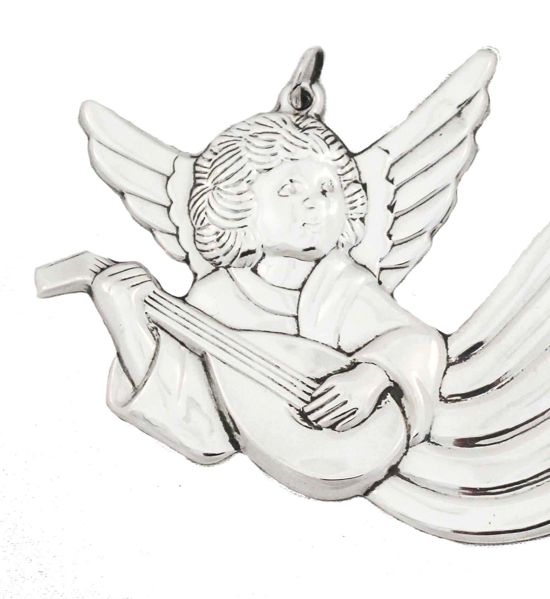 Being offered is a sterling silver Christmas ornament made by Gorham Silversmiths of Providence, Rhode Island, circa 1985.  It is of an angel play a musical instrument and announcing the good news of the birth of Jesus.  A beautiful addition to your