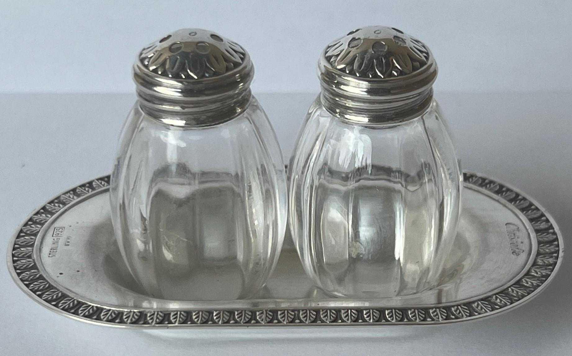 Small sterling silver salt and pepper shakers and tray, made in France by Christofle in the Malmaison pattern.

Malmaison, an Empire style is named after the castle which was a favorite vacation spot for Emperor Napoleon Bonaparte and Empress