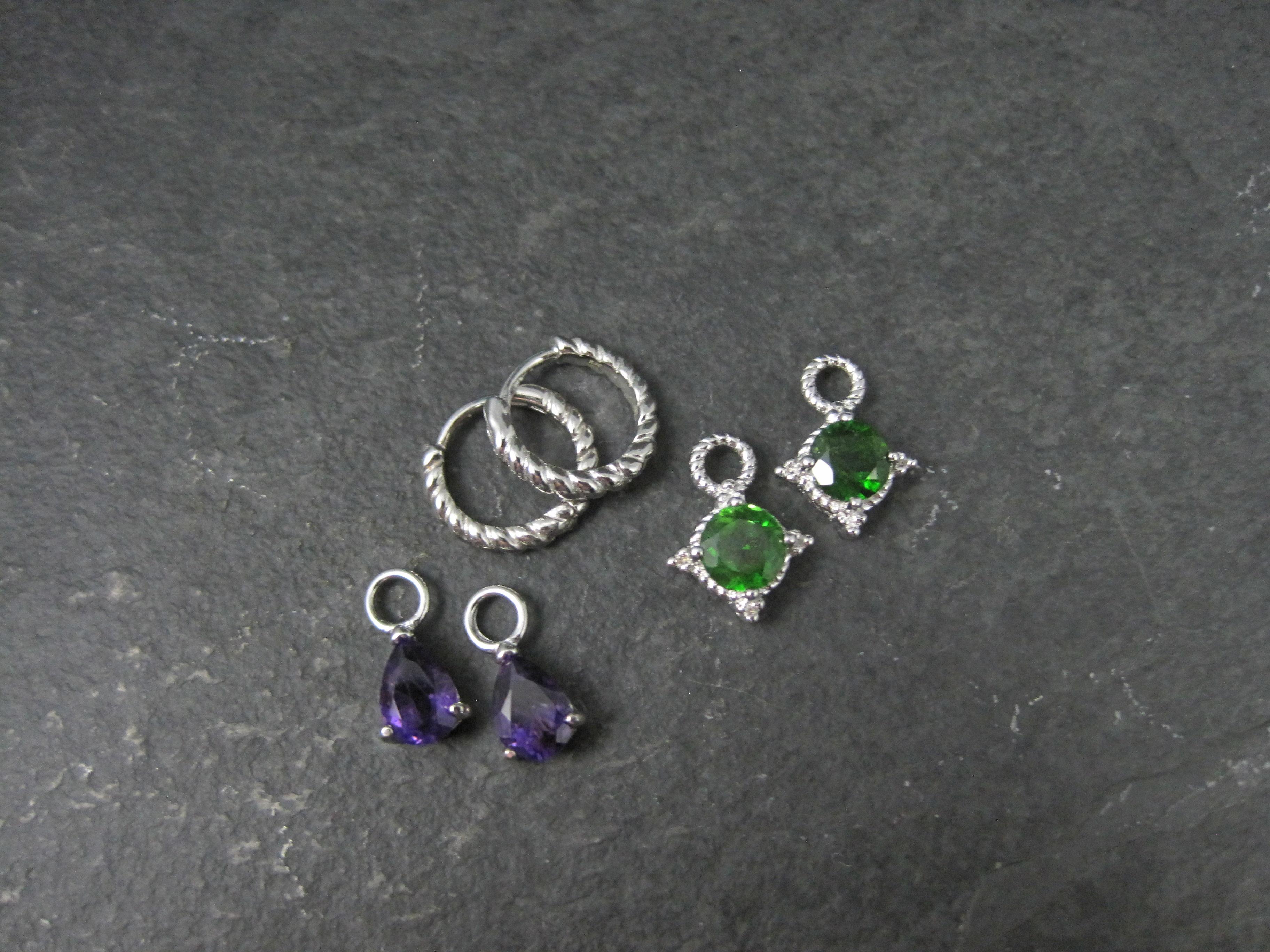 These beautiful hoop earrings are sterling silver. They feature interchangeable sterling silver charms with amethysts and chrome diopside gemstones.

Measurements: The hoop earrings measure 1/2 of an inch. The pear cut amethysts measure 5x7mm. The