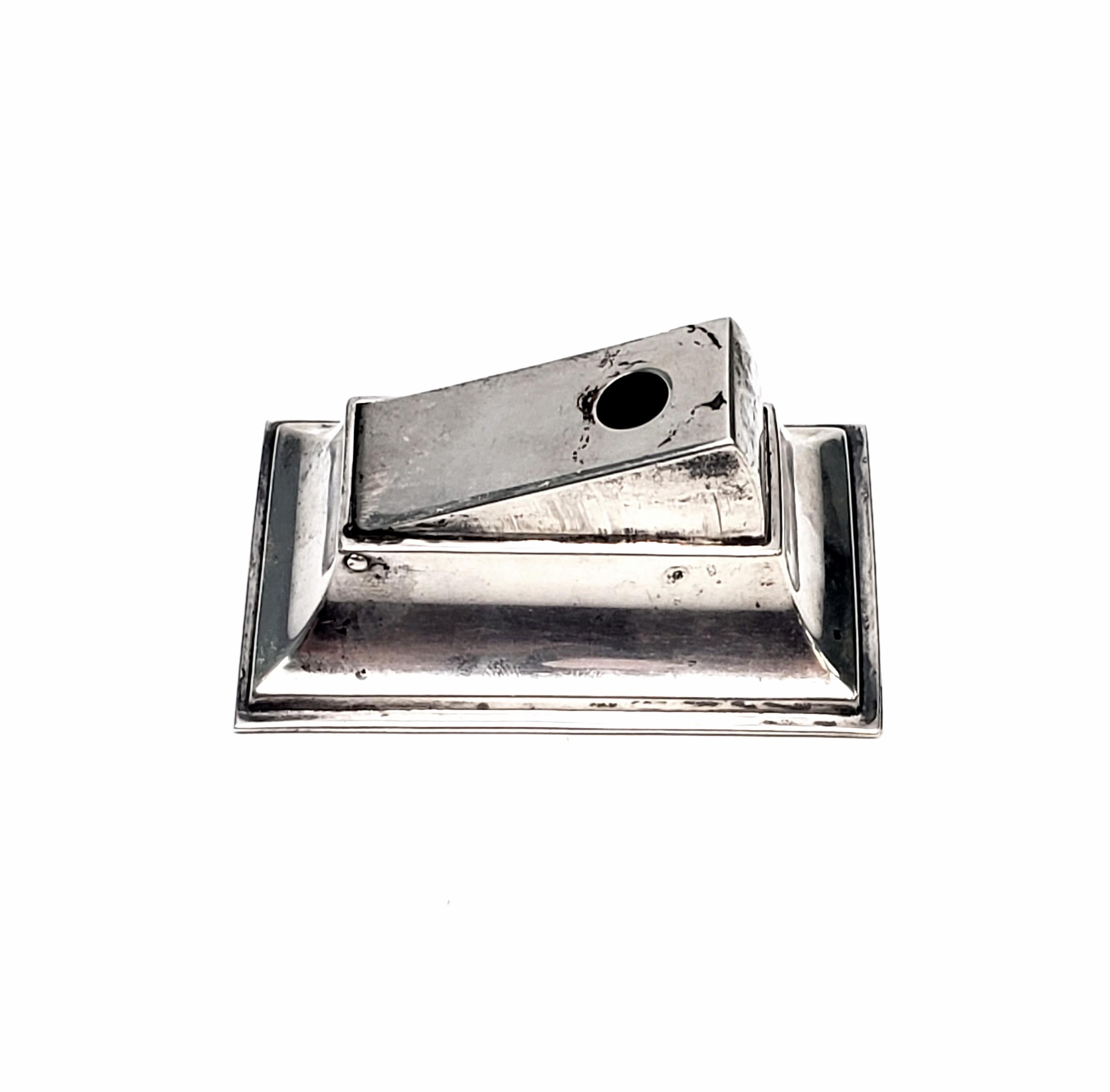 Vintage sterling silver cigar/cigarette cutter by Merrill Shops of NYC.

The Merrill Shops was a small shop specializing in small items and custom work from 1893-1931. This piece is a small box with a cigar/cigarette cutting mechanism. Bottom