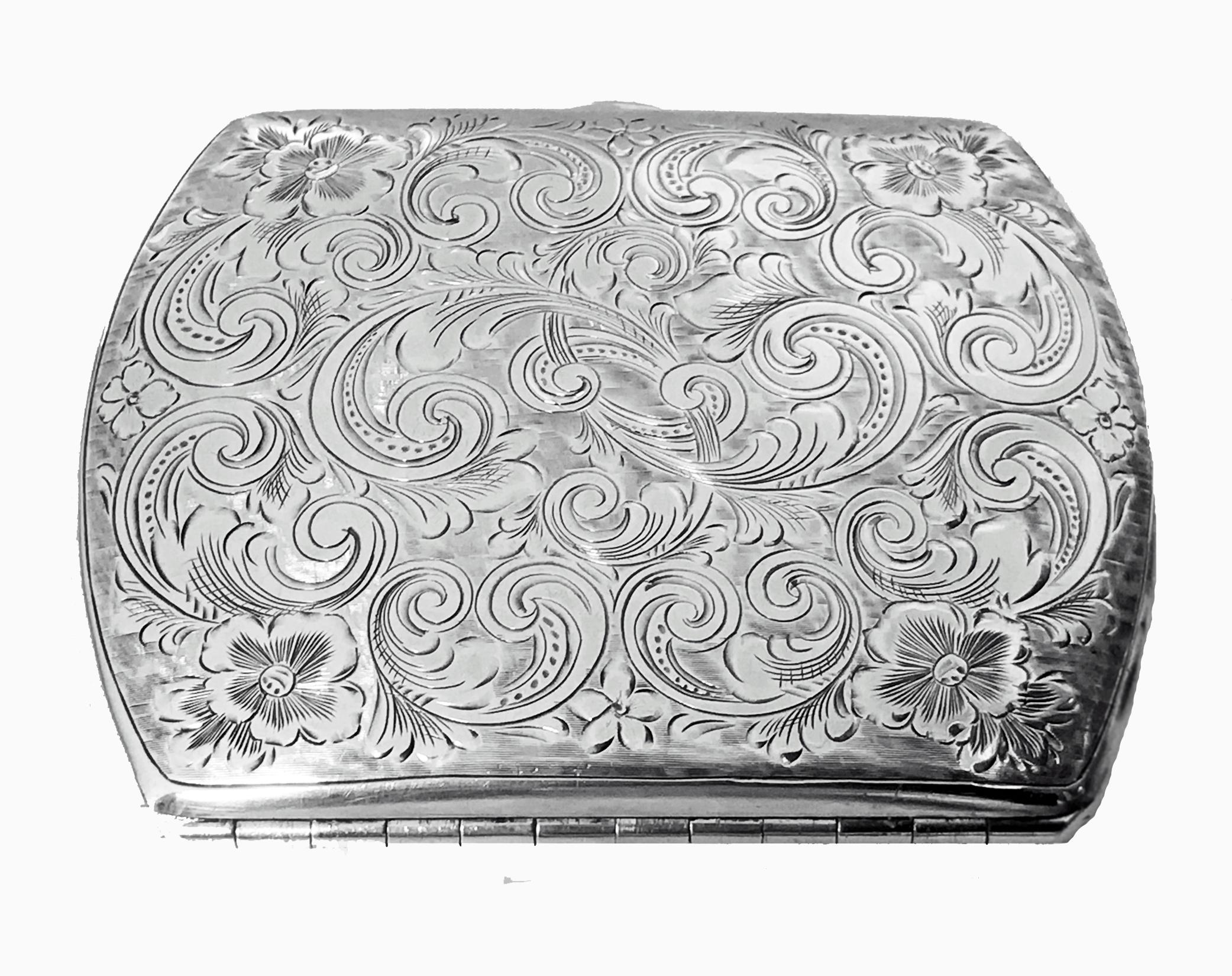 Antique Sterling Silver Cigarette or Card Case, American C.1920. The case of slightly rounded form richly engraved with foliate decoration, possible intricately engraved monogram to one side, but may be part of decoration, orange cabochon carnelian
