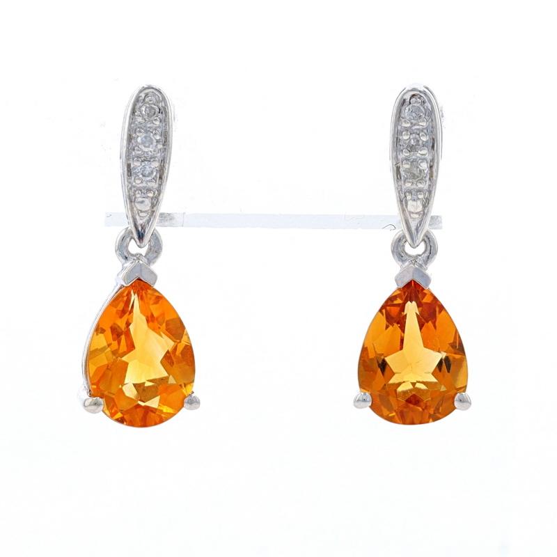 Metal Content: Sterling Silver

Stone Information

Natural Citrines
Treatment: Heating
Carat(s): 1.70ctw
Cut: Pear
Color: Yellow

Natural Diamonds
Carat(s): .04ctw
Cut: Single
Color: H - I
Clarity: I1

Total Carats: 1.74ctw

Style: Dangle
Fastening
