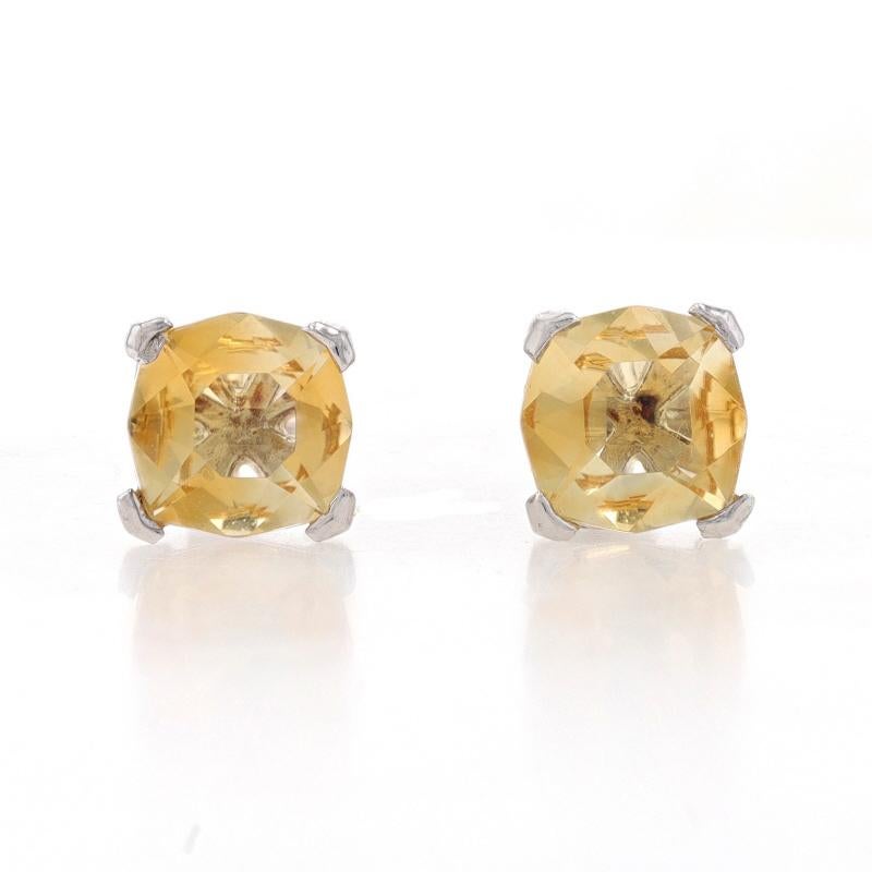 Metal Content: Sterling Silver

Stone Information
Natural Citrines
Treatment: Heating
Carat(s): 2.75ctw
Cut: Cushion
Color: Yellow

Total Carats: 2.75ctw

Style: Stud
Fastening Type: Butterfly Closures

Measurements
Tall: 11/32