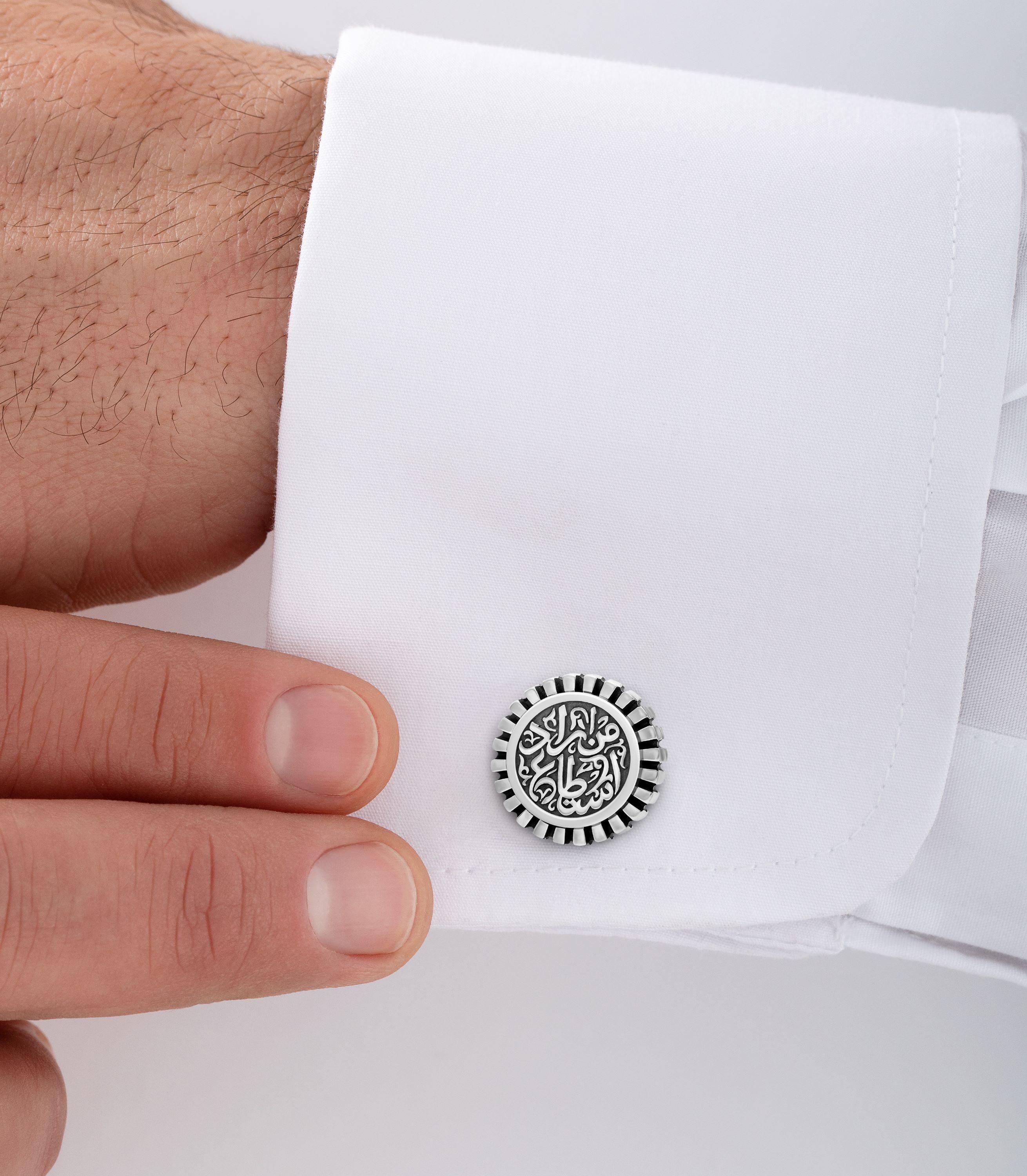 Classic Sterling Silver Cufflinks inscribed with calligraphy. 

Fusing the modern and traditional, the Sterling Silver Power Cufflinks are inscribed with calligraphy that
affirms, ‘من اراد استطاع’ – 