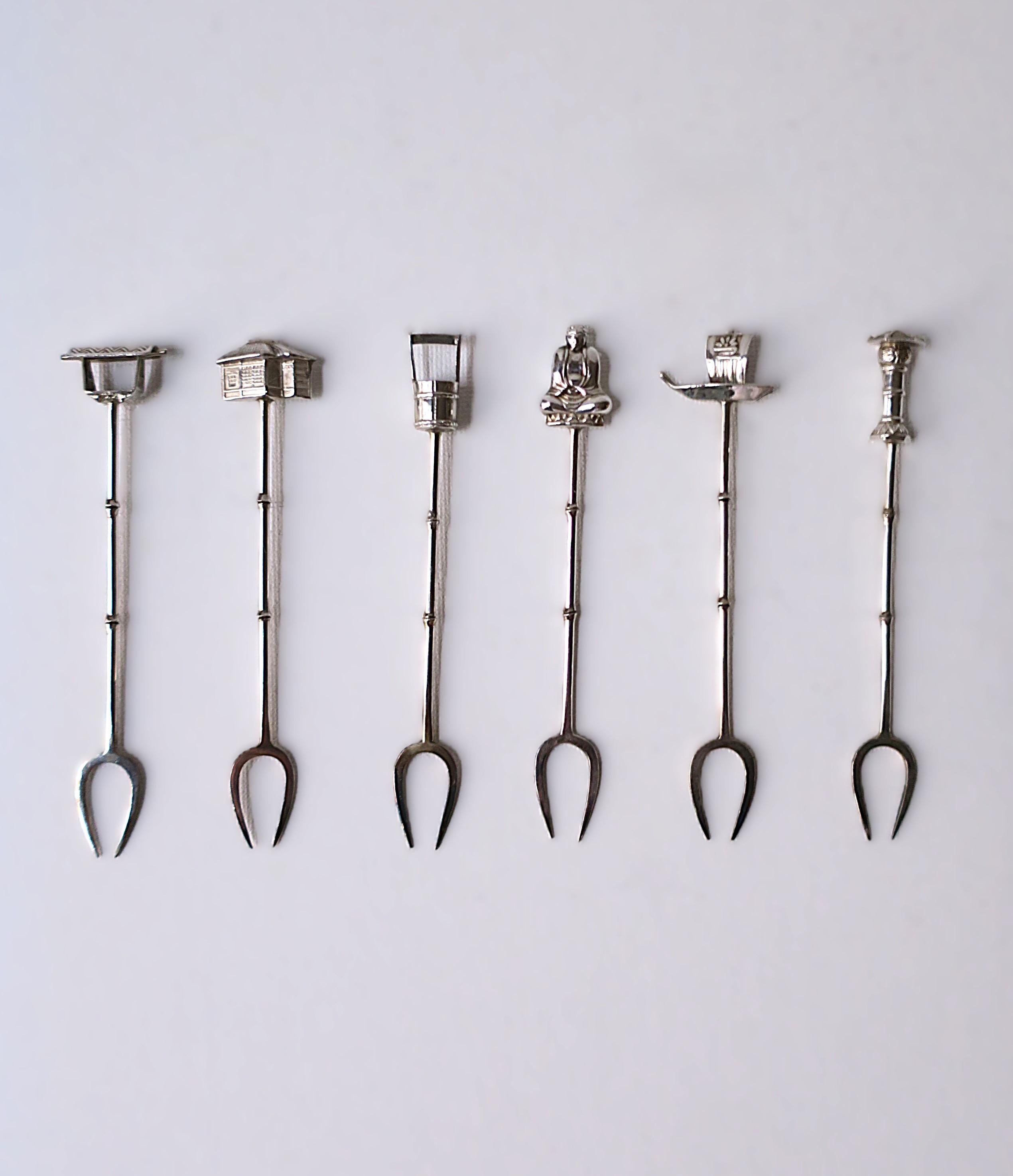 Beautiful and detailed Japanese sterling silver cocktail or appetizer fork picks by Asahi Shoten, Yokohama, Japan. circa early-20th century, Japan. This well-made set includes six forks (6) each with a different 'charm' atop, including a detailed