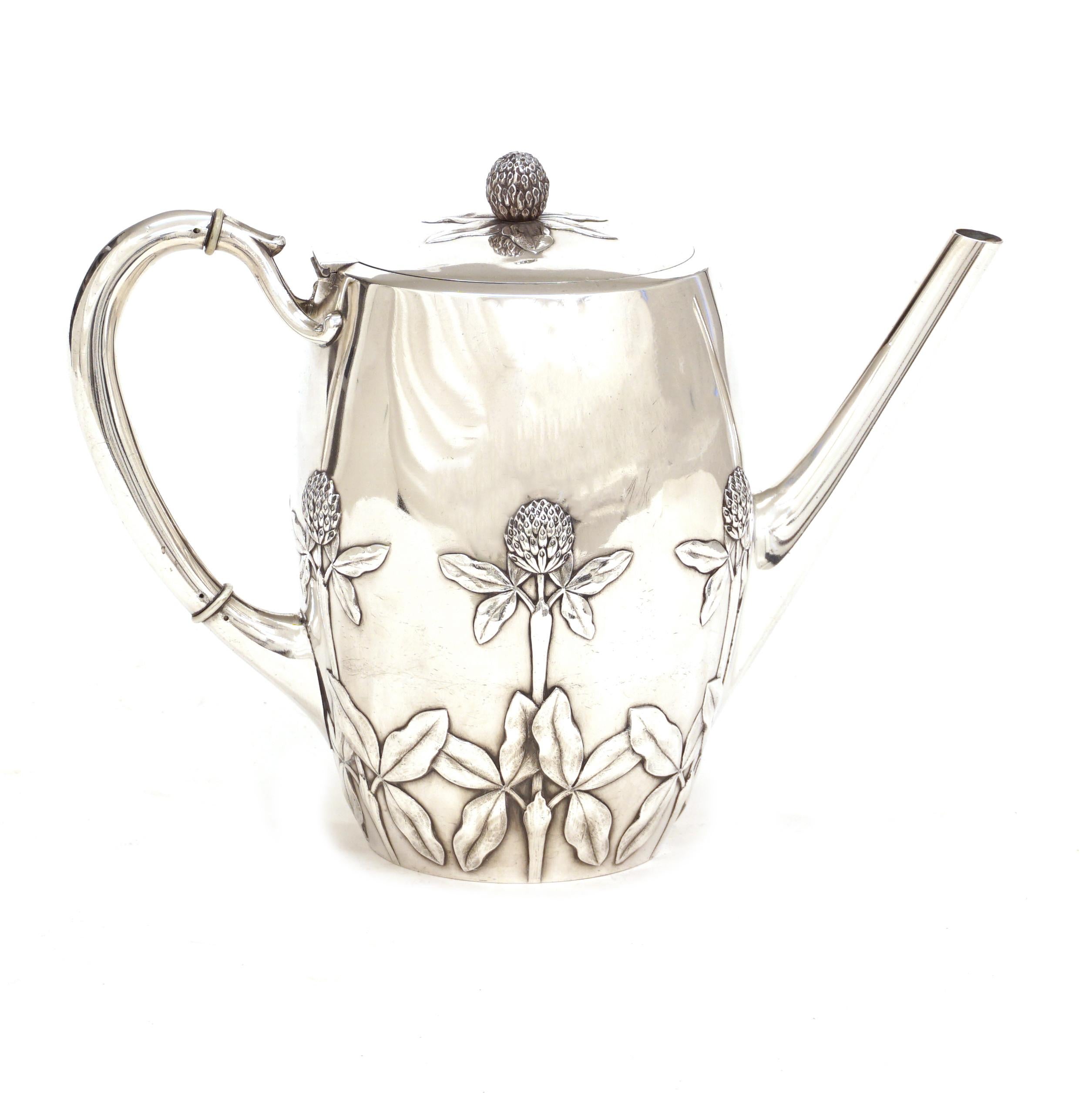 A very rare and complete sterling silver coffee and tea set in the manner of N. G. Henriksen, 1855-1922, leading silversmith at A. Michelsen, Copenhagen, 1888-1922. Henriksen was inspired by the Danish nature and created this coffee and tea set with