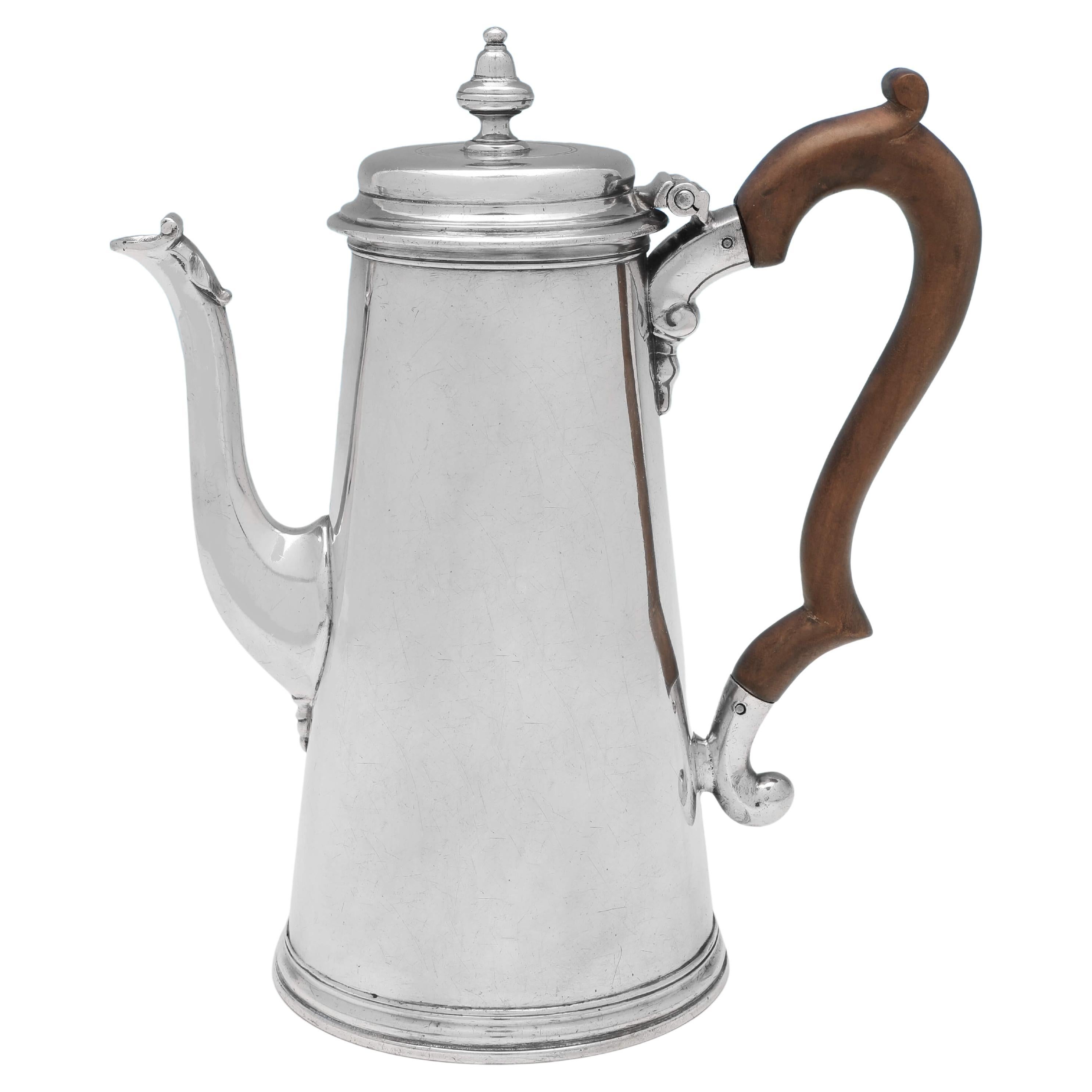 Hallmarked in London in 1730 by John Swift, this very handsome, George II, Antique Sterling Silver Coffee Pot, is straight sided, and features an armorial engraving to one side. The coffee pot measures 9.25