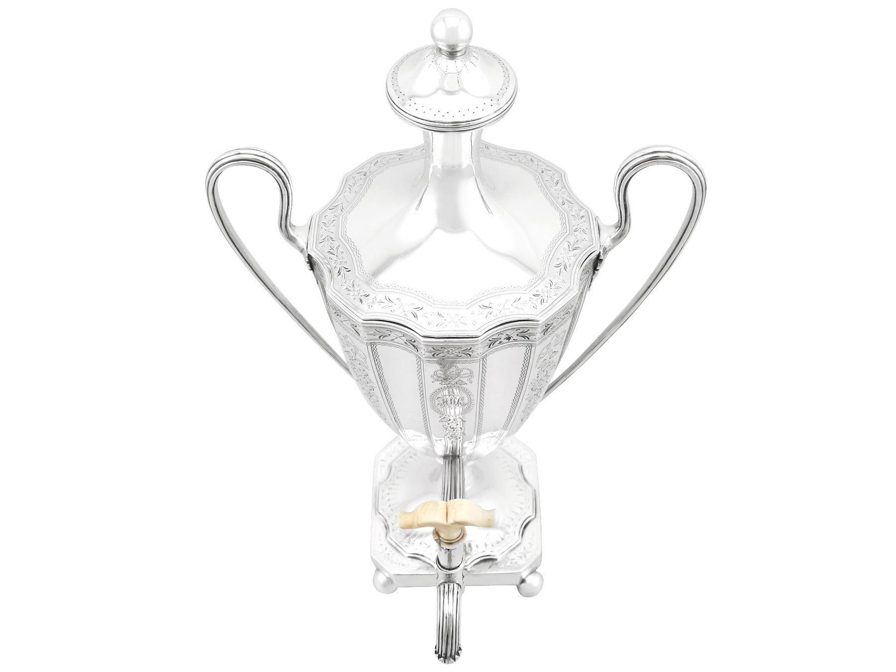 An exceptional, fine and impressive antique George III English sterling silver coffee urn/samovar; an addition to our Georgian silver teaware collection

The alternating concave paneled body of this impressive antique Georgian coffee urn is