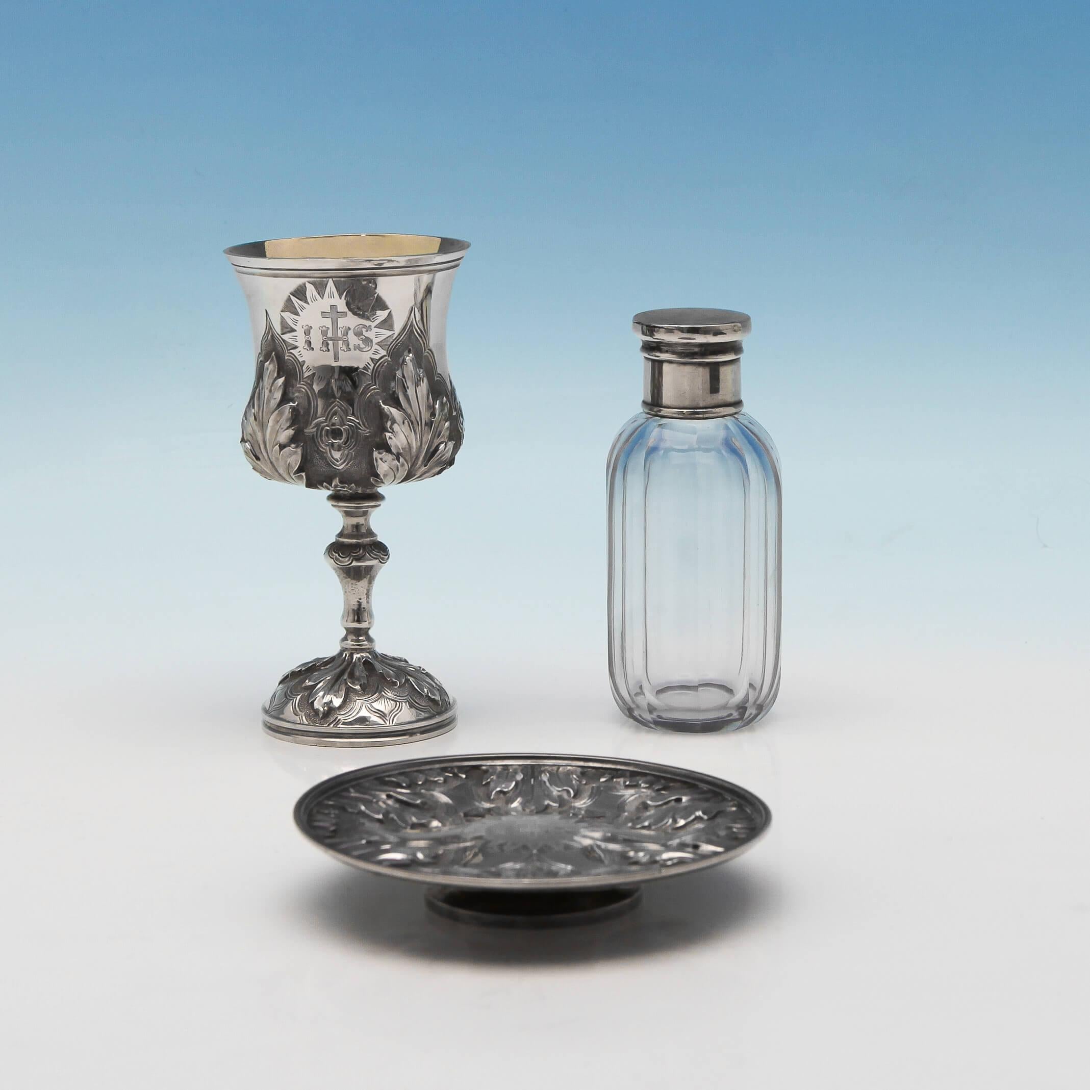 Hallmarked in London in 1872 by Charles Reily & George Storer, this fine antique, Victorian, sterling silver communion set comprises of a chalice with gilt interior measuring 4