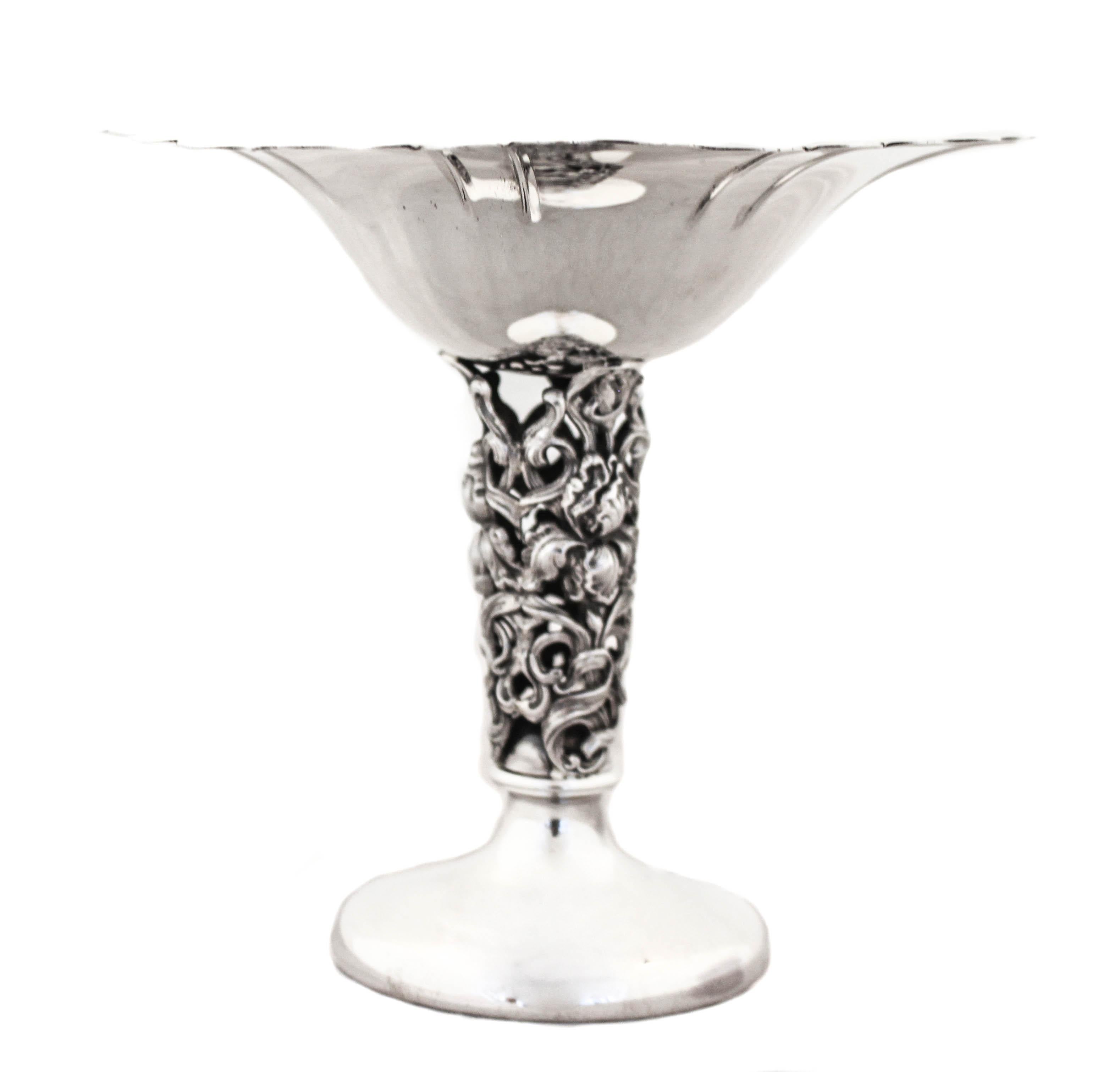 We are delighted to offer you this pair of sterling silver compotes. An interesting mix between ornate and contemporary; this pair has the best of both. The rim is scalloped and sleek as is the base but the stem has blown-out flowers with open work