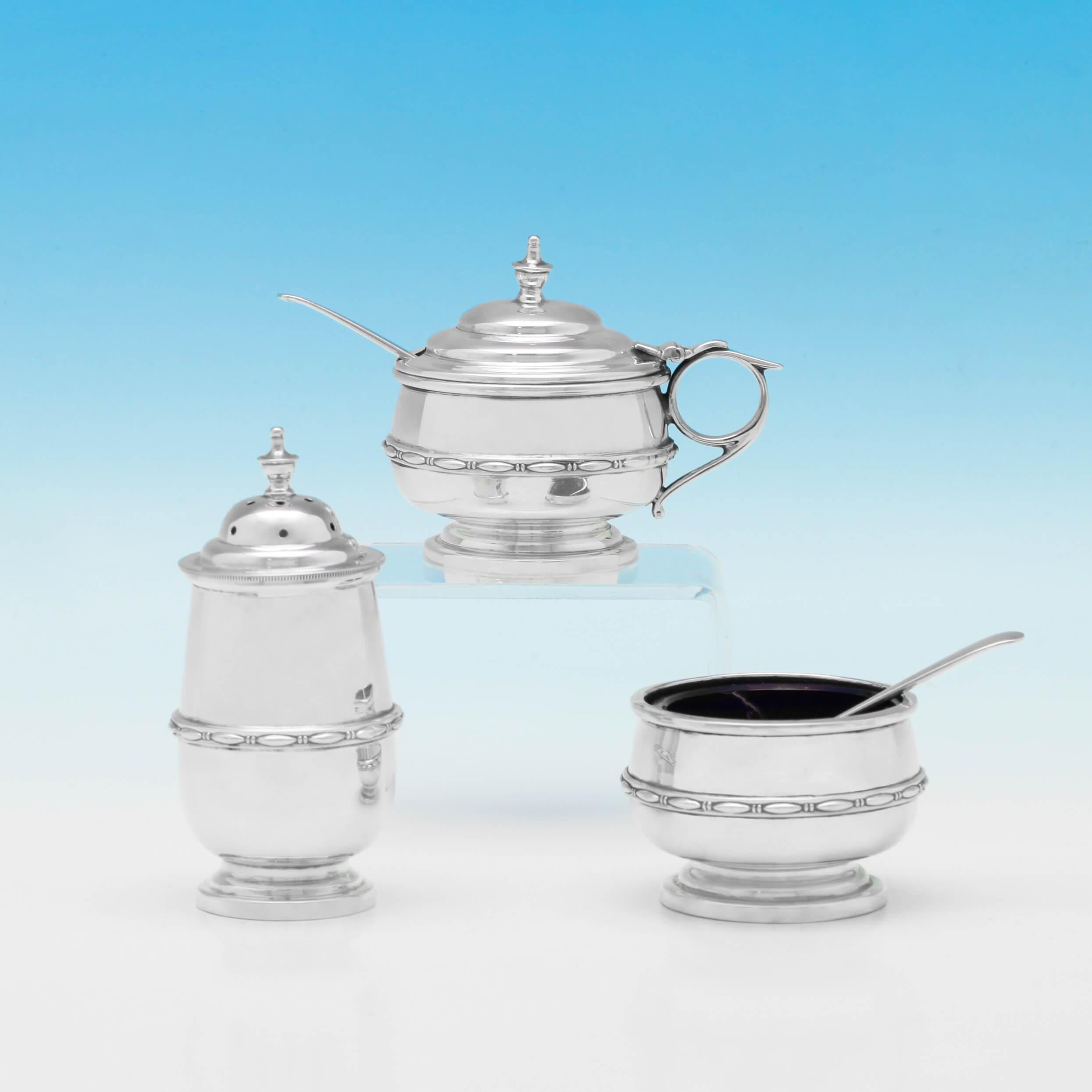 Hallmarked in Sheffield in 1928 by Walker & Hall, this lovely Sterling Silver Condiment Set, comprises of four pepper pots, four salt cellars with salt spoons and four mustard pots with mustard spoons. The pepper pots measure 3.5