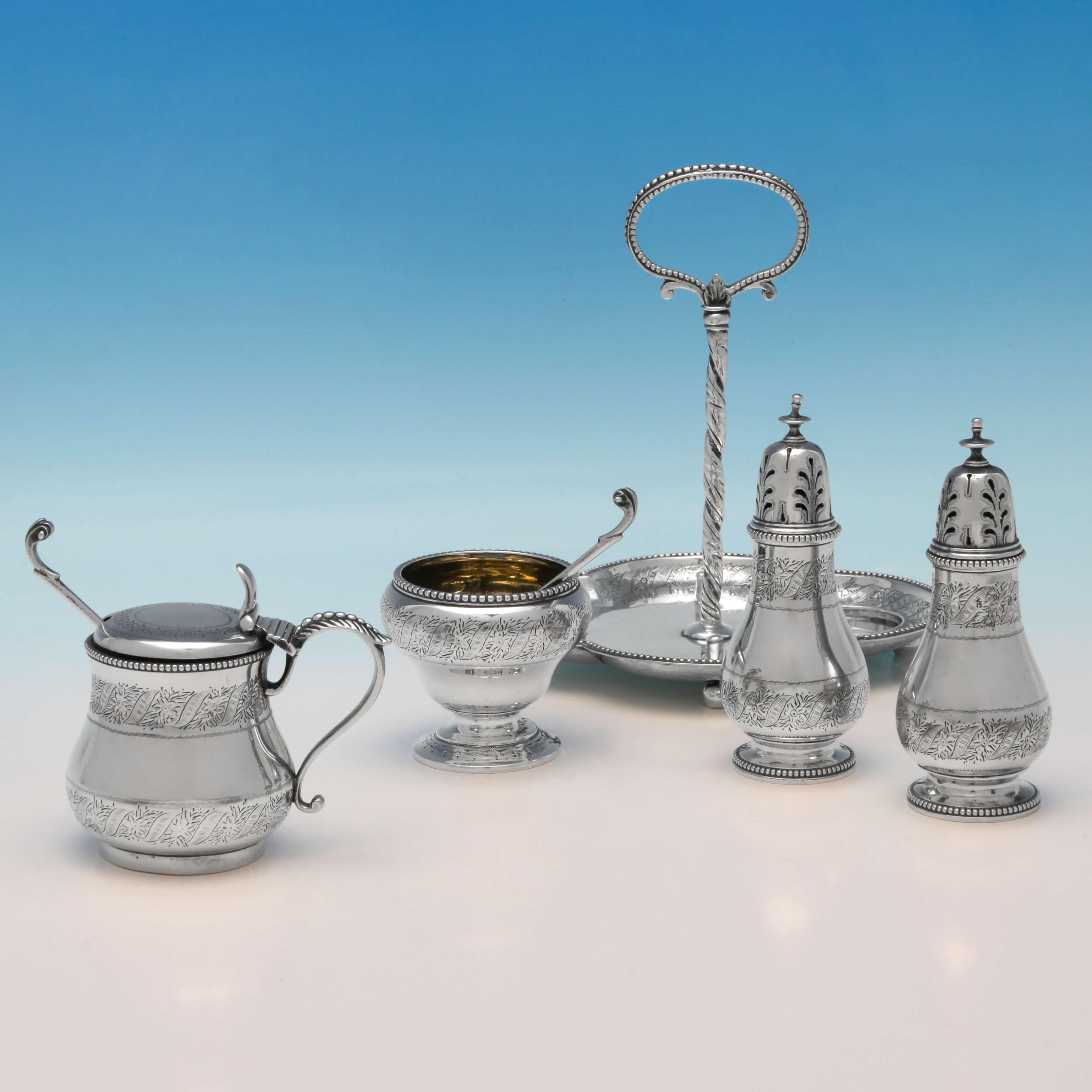 Hallmarked in London in 1868 by George Fox, this very attractive, Victorian, Antique Sterling Silver Condiment Set, comprises a mustard pot, salt cellar, two spoons and two pepper pots, all featuring bright cut engraved decoration, and bead borders.