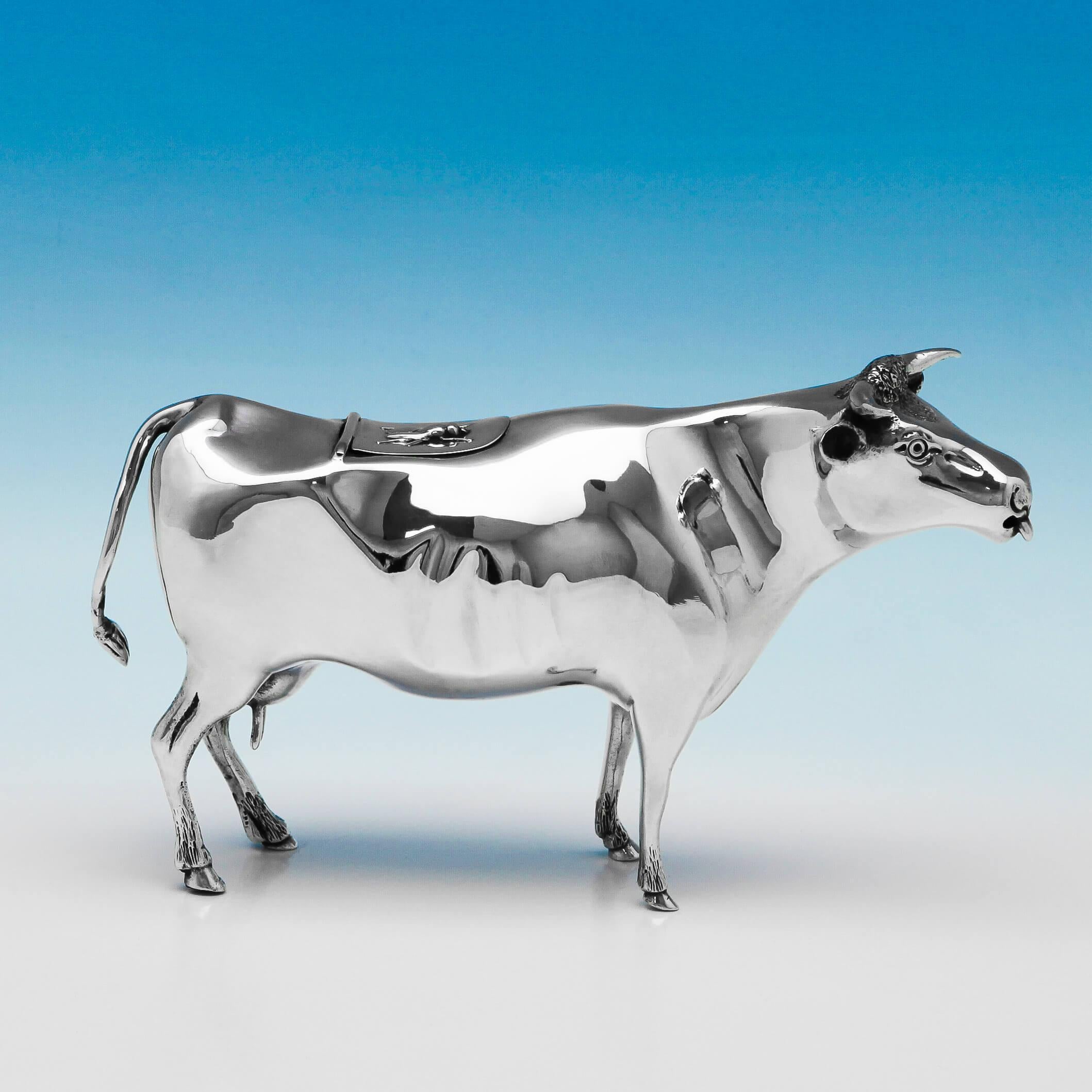 Hallmarked in London in 1899 by Maurice Freeman, this handsome and rare, Victorian, antique, sterling silver cow creamer, is well modelled. The cow creamer measures 6.5