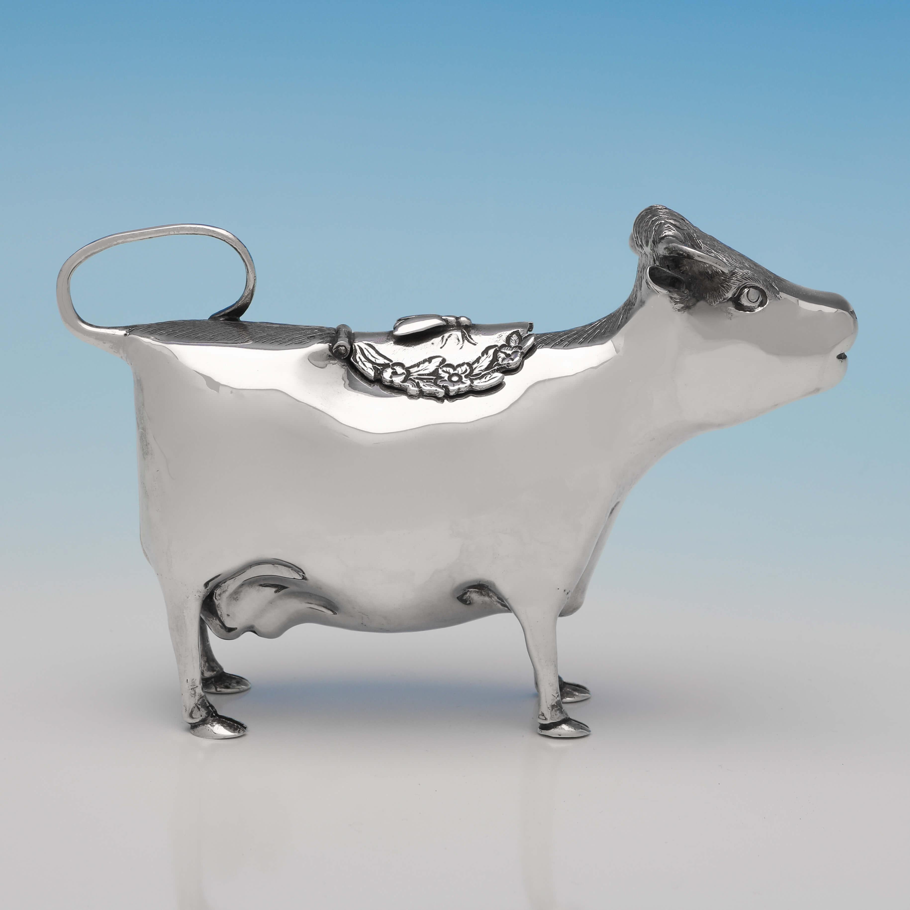 Hallmarked in London in 1968 by William Comyns, this charming, sterling silver cow creamer, is full of character. The cow creamer measures 4