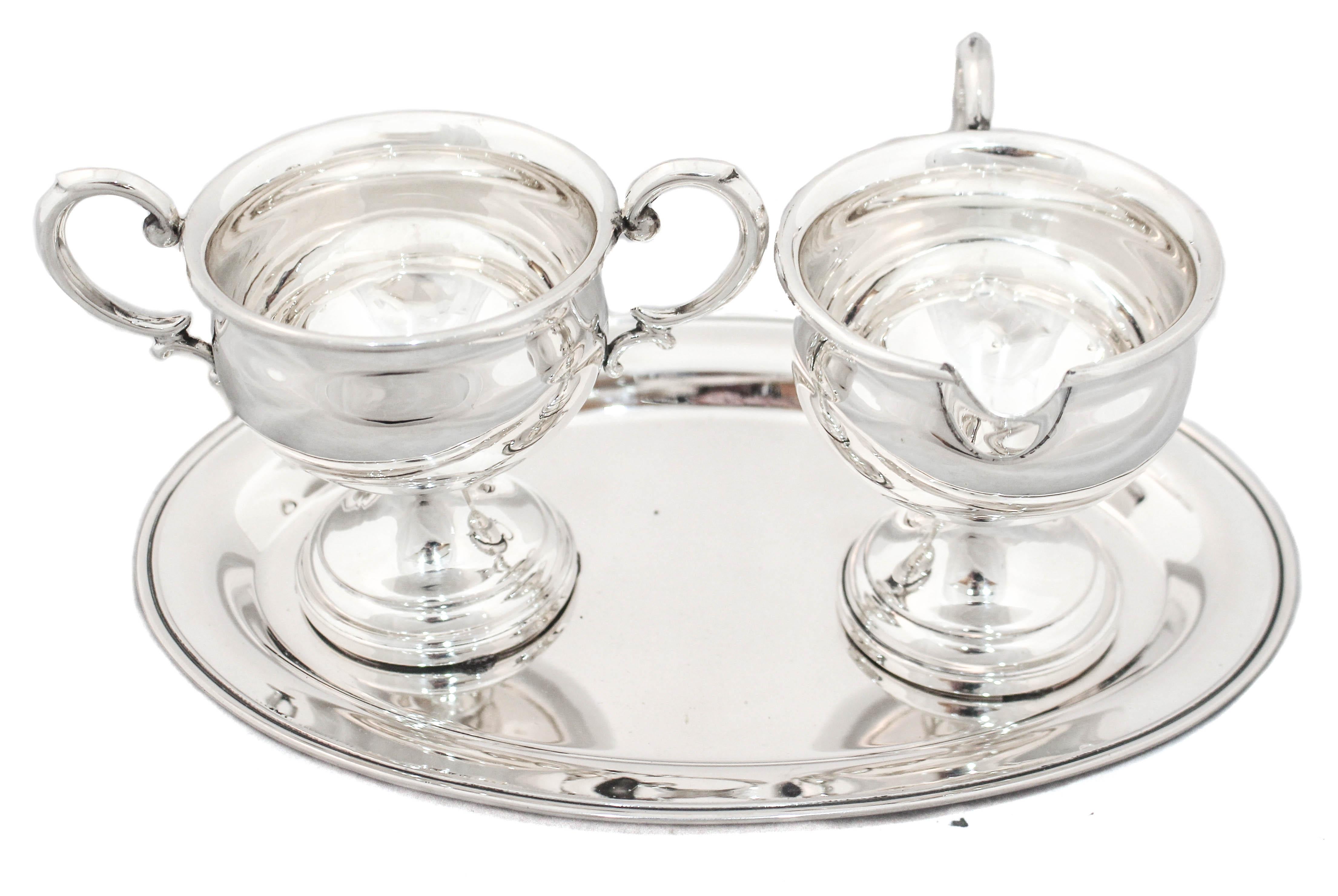 We are happy to offer you this sterling silver cream and sugar bowl with tray by M. Fred Hirsch Silver.  Designed and manufactured during WWII, it’s simplicity reflects that period; austere and understated.  Whether for yourself or while