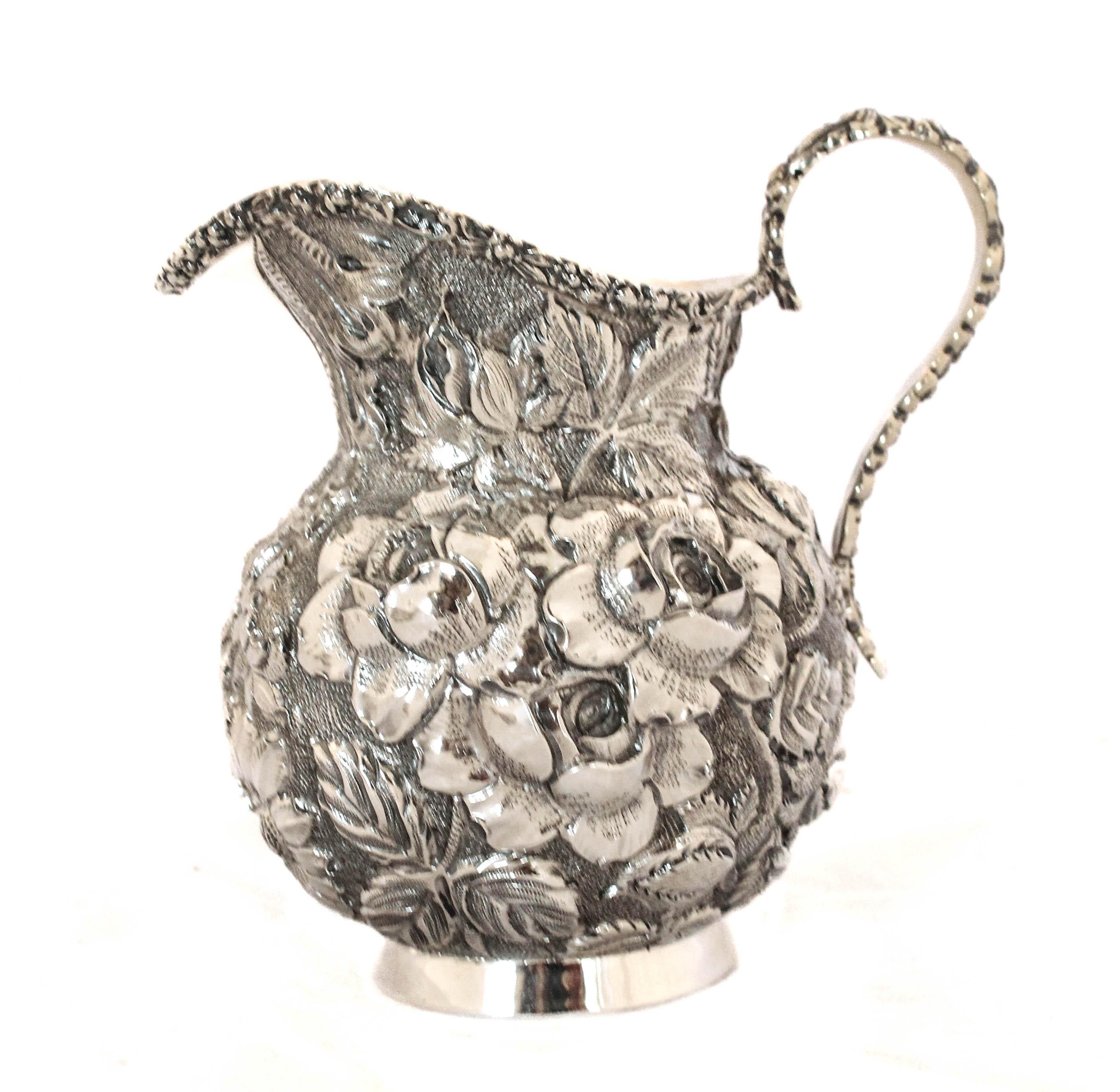 Proud to offer this sterling silver tray with a creamer & sugar bowl.  Designed and manufactured by S. Kirk & Sons of Maryland in their iconic “Repousse” pattern.  S. Kirk and Repousse became synonymous with each other; it would quickly become their