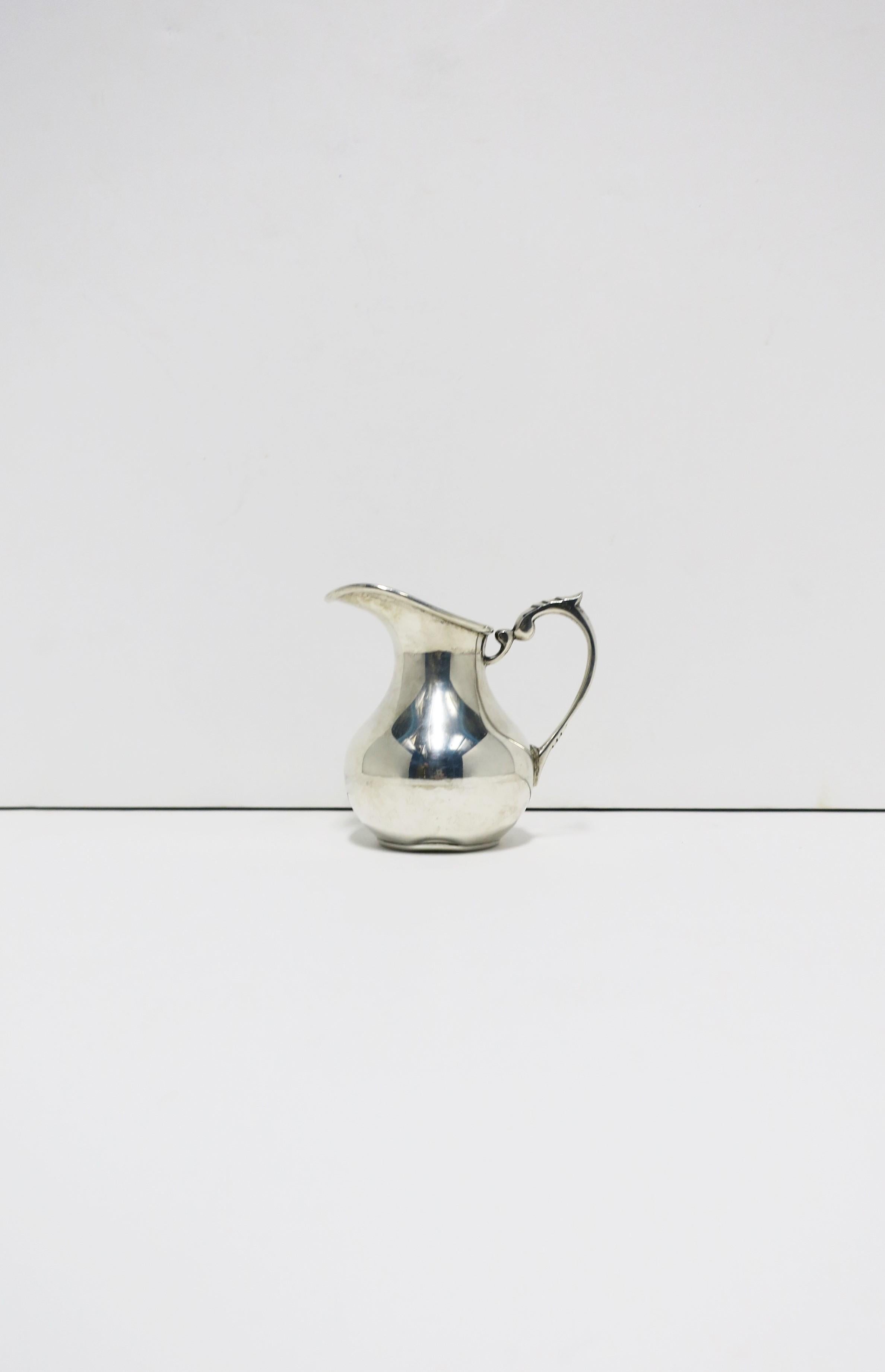 A beautiful Chilean sterling silver creamer pitcher, circa mid-20th century, Chile. With maker and metal marks on bottom as shown in image #9. Dimensions: 2.75