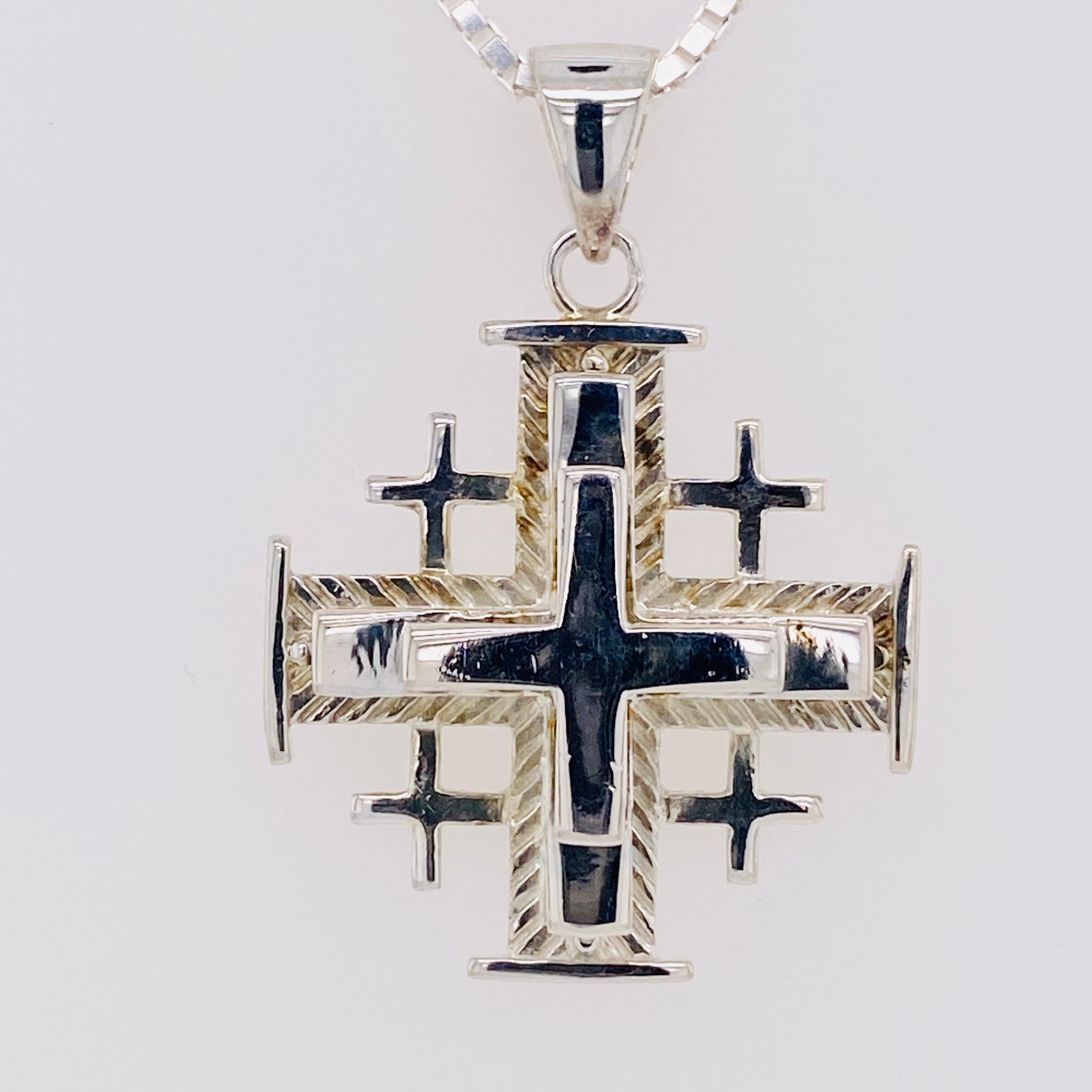 This pendant is truly unique in its design! This piece is heavy and well made with a wonderful matching 18-inch box chain!

Sterling Silver
18-Inch Box Chain 

This piece is very sentimental and well made. It has 3 crosses overlapping each other
