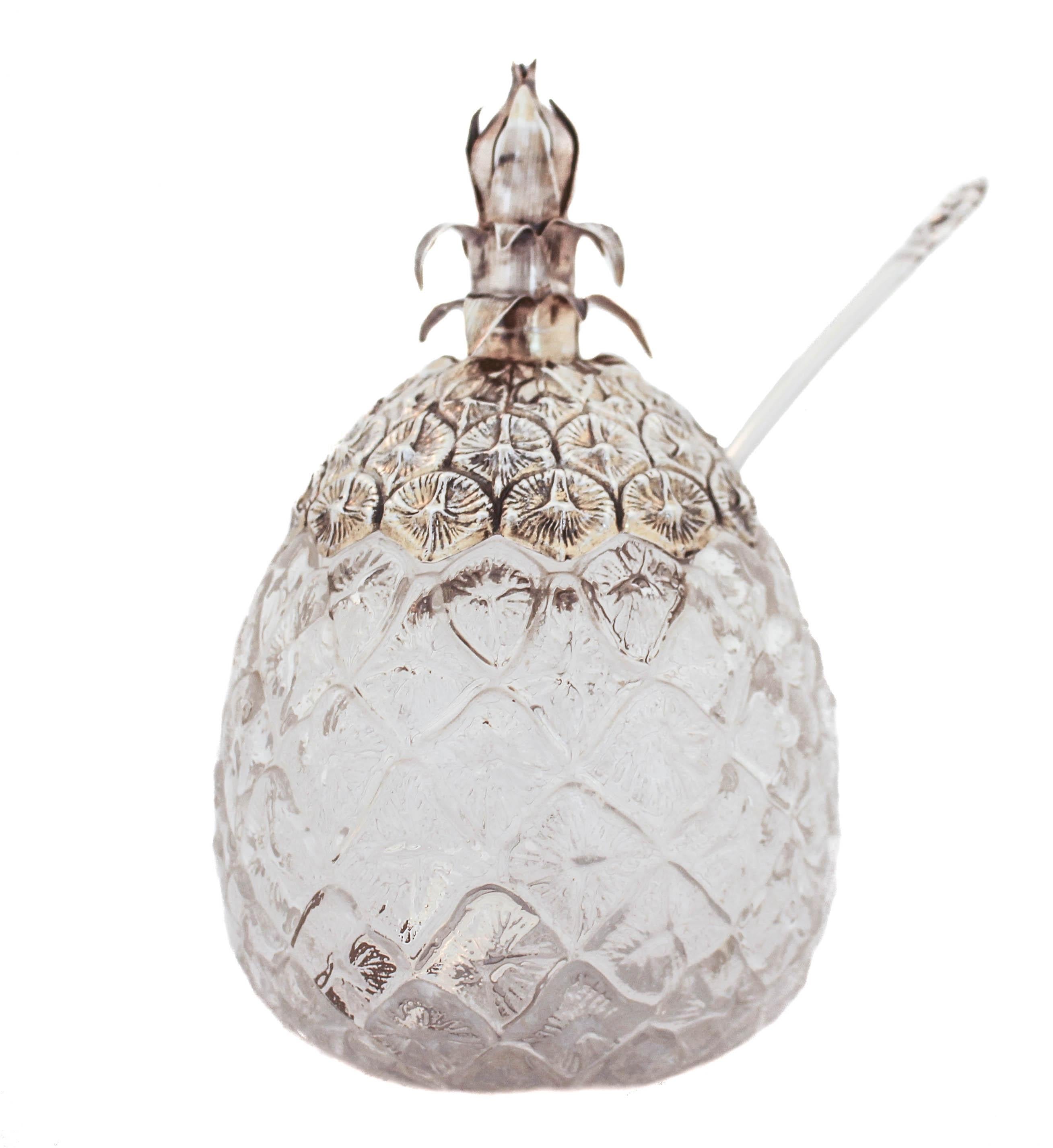 Being offered is a rare sterling silver and crystal jar shaped like a pineapple with a serving spoon.  The sterling lid is exactly like a pineapple crown — in shape and texture.  The crystal jar has frosted glass and texturized to feel and look like