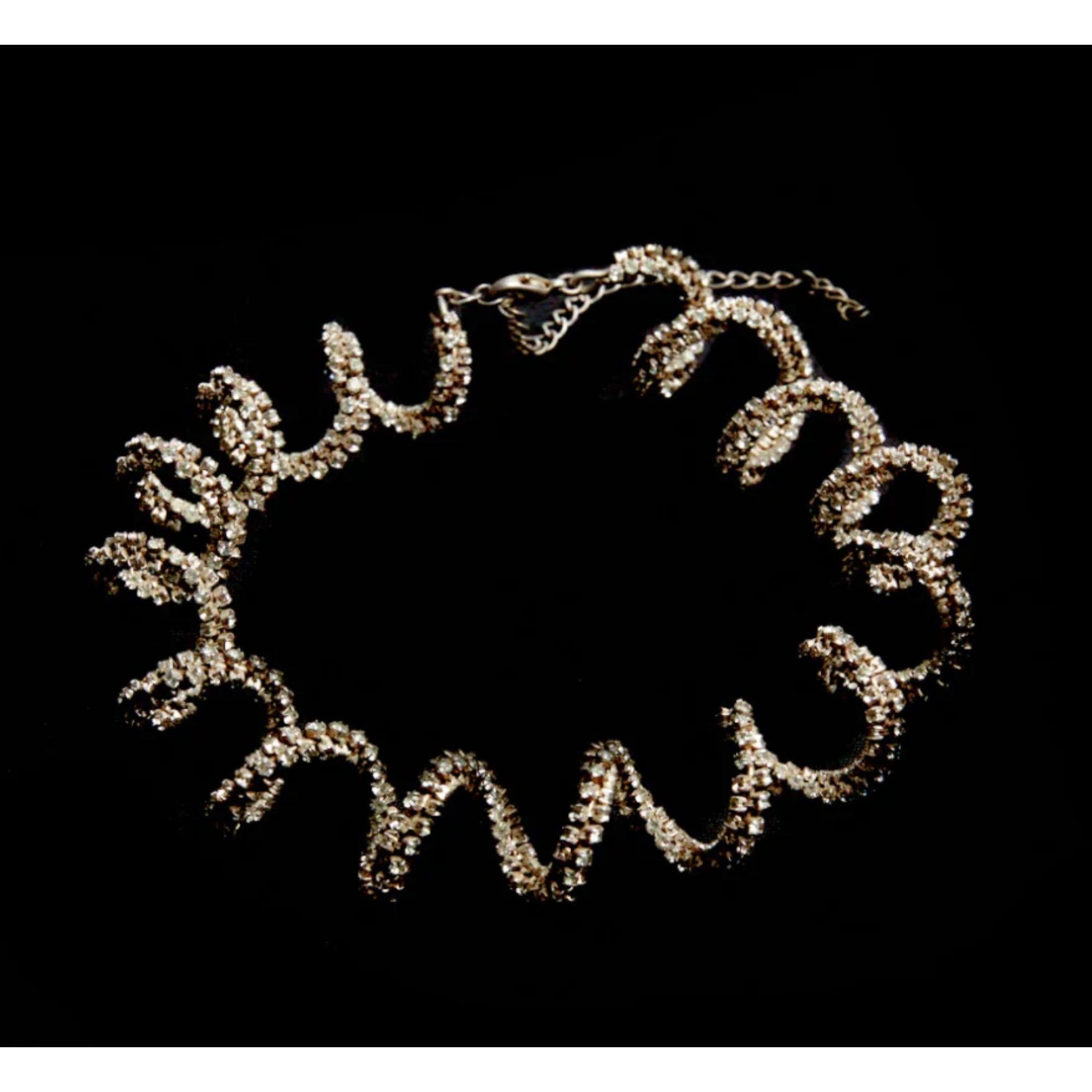 A playful necklace. Handmade and molded out of crystal rows in the shape of squiggles. Dipped in sterling silver. One of a kind.

Additional Information:
Material: Sterling silver