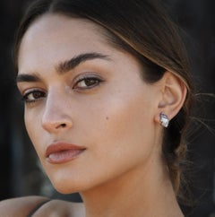 Sterling Silver Curving Stud Earring w/ White Topaz Baguettes w/ 14kt Gold Posts