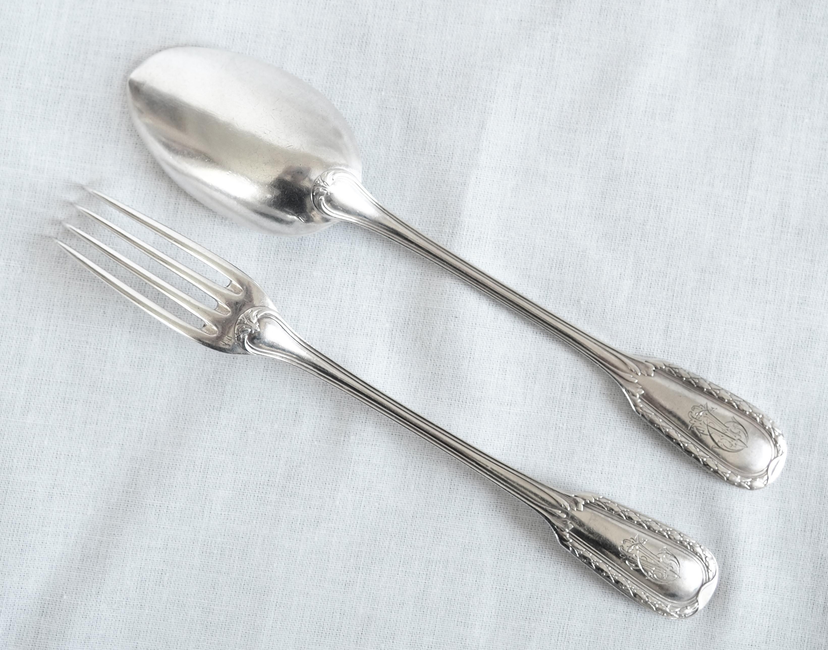 A fine sterling silver cutlery set for a child composed of a fork and a spoon by French silversmith Emile Puiforcat. Chic Louis XVI style pattern : elegant and sober shape, laurels frieze chiseled ornamentation.
There is a EV monogram on the