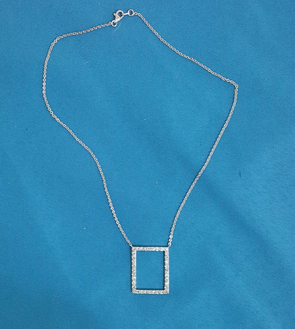 Sterling Silver & CZ Pendant Necklace, Vintage, Stamped.
The open rectangle pendant has what we think are tiny CZs in it. It is stamped on the back of the rectangle and also on the chain connector.  
IMPORTANT INFORMATION FOLLOWS; PLEASE READ THE