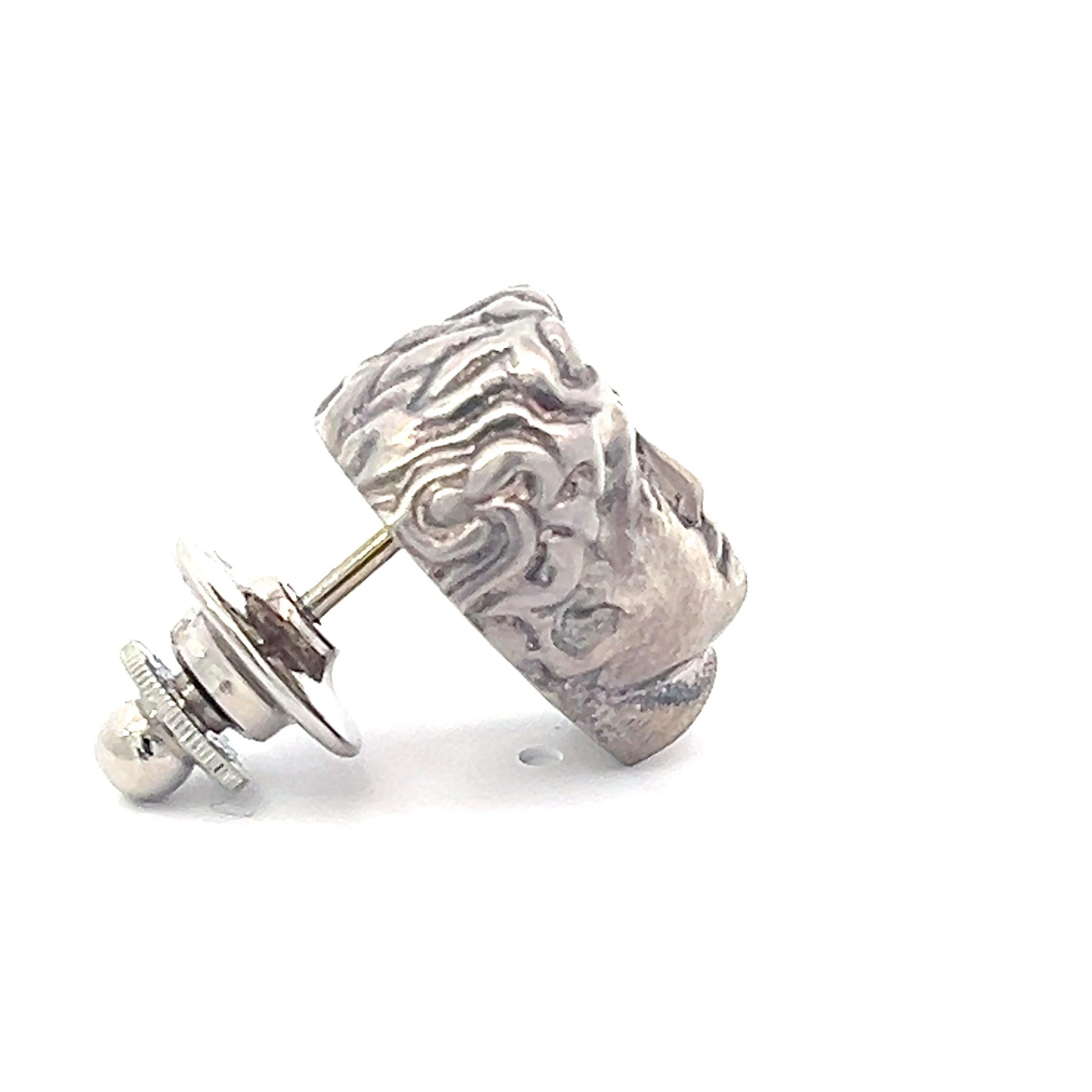 Embrace iconic artistry with our Sterling Silver David Head Lapel Pin/Tie Tack. Meticulously crafted, this accessory captures the timeless beauty of Michelangelo's David, showcasing the iconic head in exquisite detail. Cast in sterling silver, the