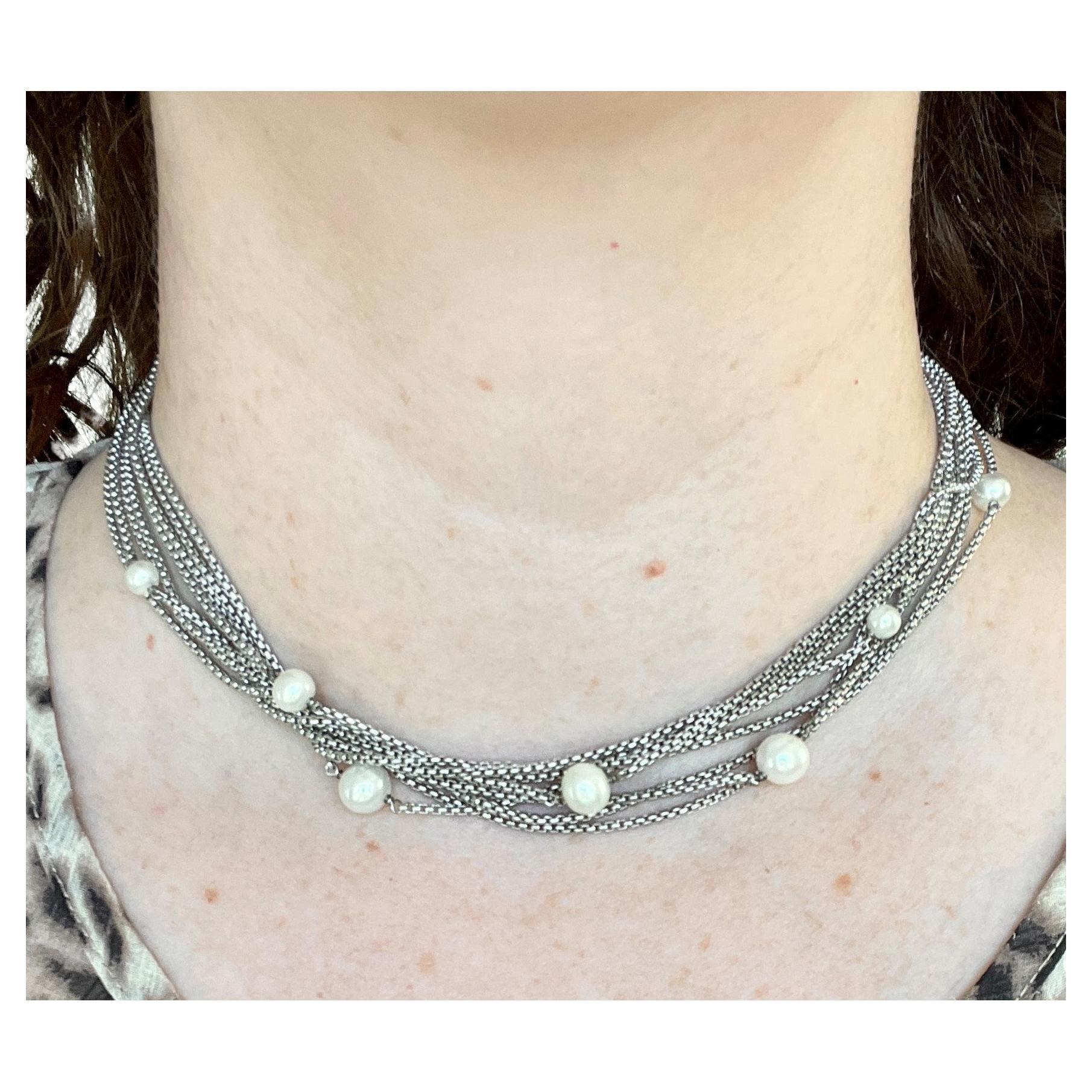 Classically David Yurman, this multi-strand sterling necklace is accented throughout with cultured pearls ranging from 5mm-8mm. . The strands are intentionally tangled for a fresh, contemporary look, and it is finished with a high-quality, secure