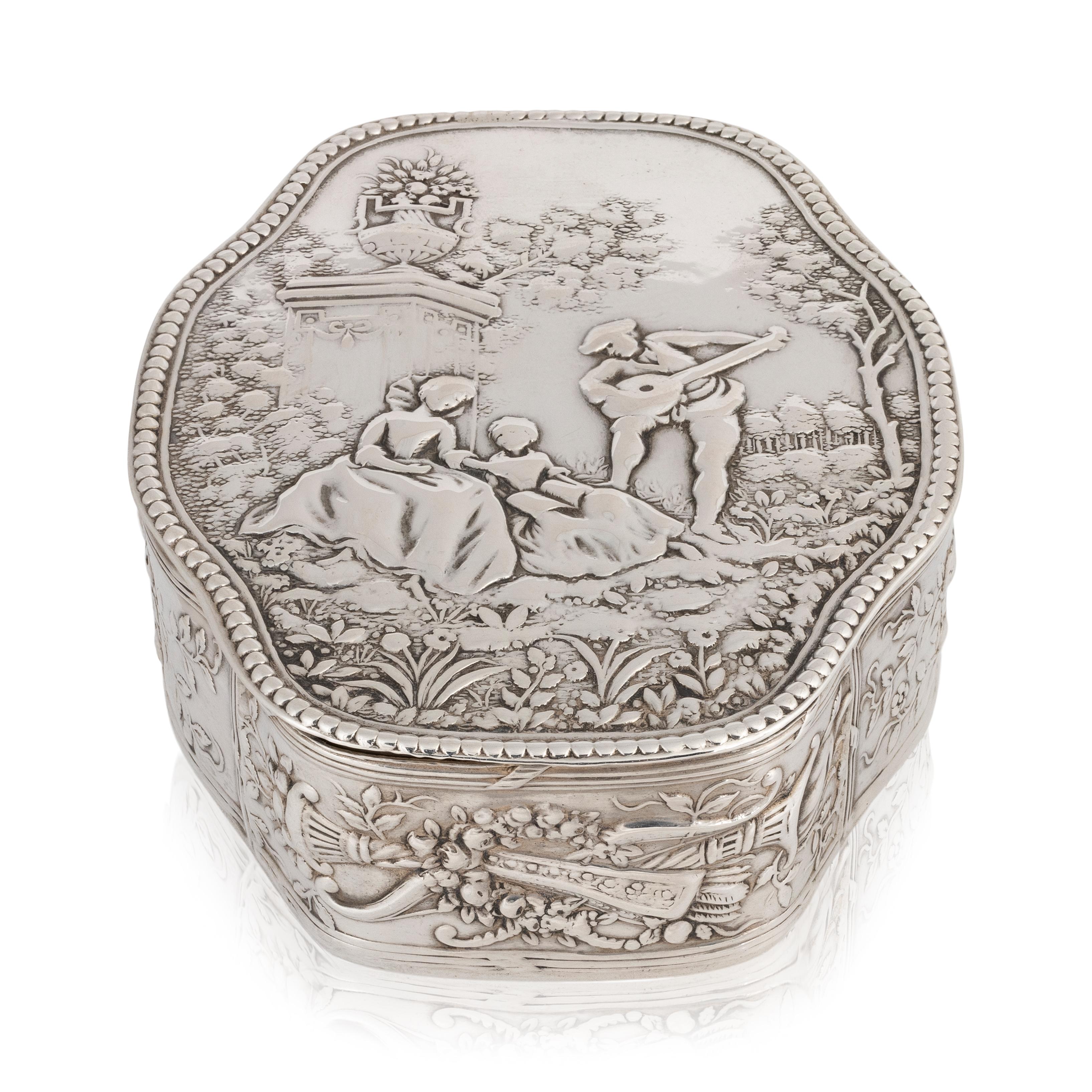 Eight sided silver lidded box with decorated sides and minstrel scene. Bottom marked 