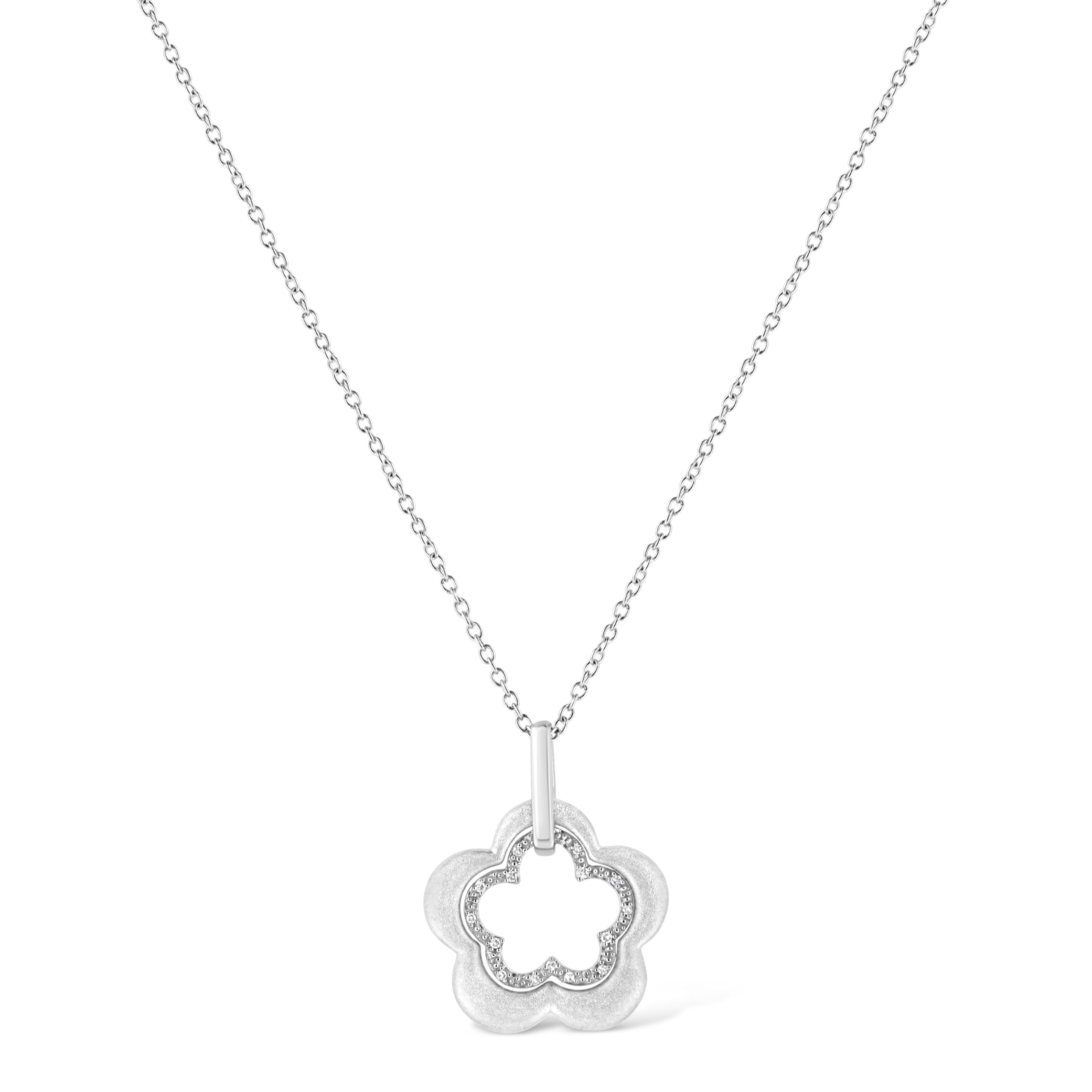 Allure your loved ones with this stylish diamond flower pendant. Gorgeous pendant rendered perfectly on glinting sterling silver showcasing 15 sparkling pave set single cut diamonds, set on floral motif and dangles from a shimmering cable chain. The