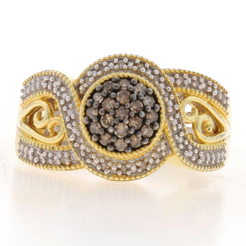 Size: 8

Metal Content: Sterling Silver (gold plated)

Stone Information

Natural Diamonds
Carat(s): .33ctw
Cut: Single
Color: Champagne Brown / H - I
Clarity: I1 - I2

Total Carats: .33ctw

Style: Cluster Halo with Accents
Features: Milgrain