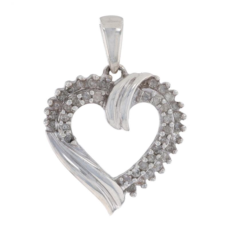 This beautiful pendant features a heart outline encrusted with natural diamonds. The diamonds have a combined 0.15 carat weight, I1 - I2 clarity and I - J - K color. The heart is accented by a woven design with a nice polished finish.
 
This piece