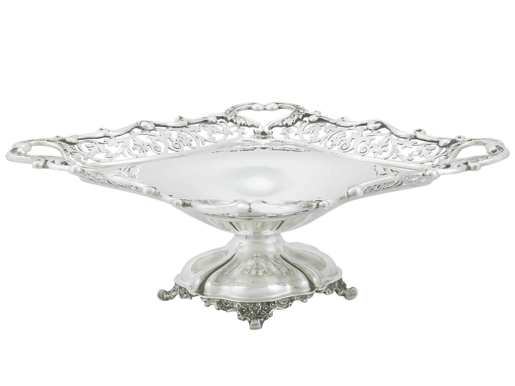 An exceptional, fine and impressive antique Edwardian English sterling silver dish; an addition to our ornamental silverware collection.

This exceptional antique Edwardian sterling silver dish has a square shaped rounded plain form onto a domed