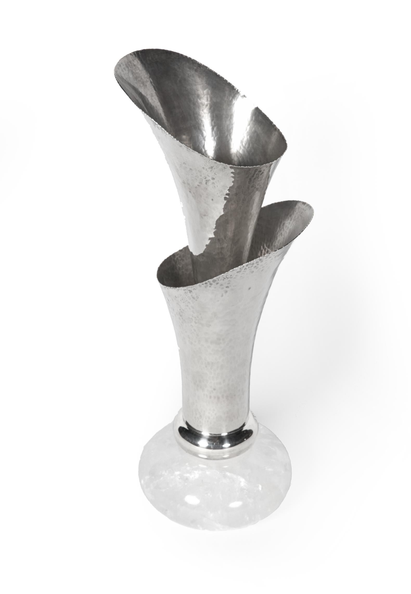 Rare and elegant this double vase by Ravissant of India is stunning. The 2 piece hammered sterling silver vase is comprised of 2 fluted cones, one inside the other. The inner cone can be removed for a single vase. The base is a silky smooth round