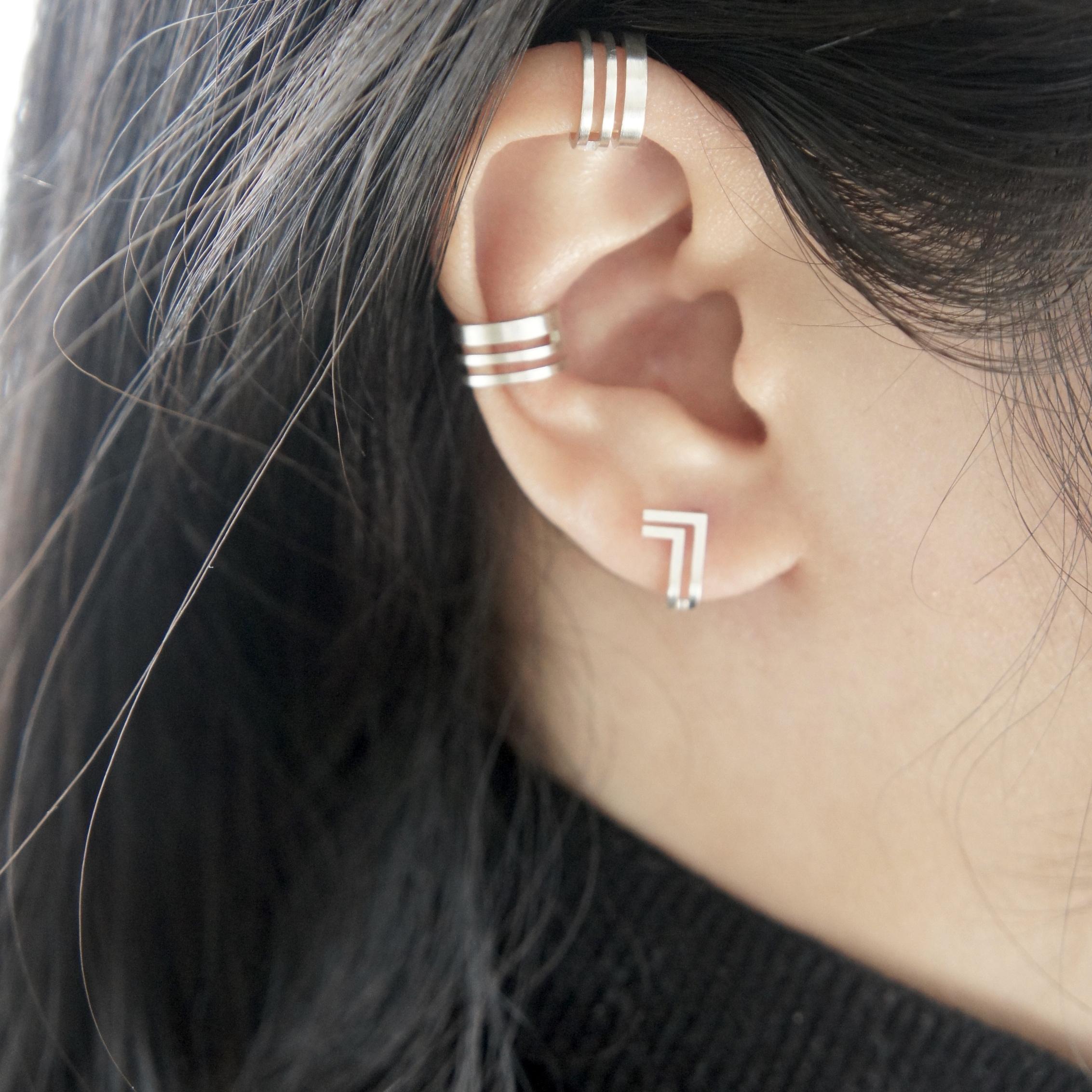 Unfinishing Line collection exudes minimalism and precision with its smooth lines and angles. 
Detailed with a perspective and flat structure with a ​brushed finish. 
Double Lines Curve Earrings is stylish to be paired with any outfit with its