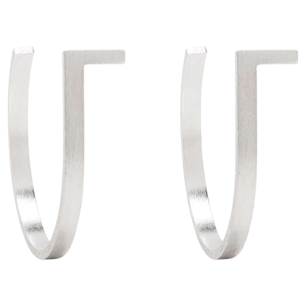 Unfinishing Line collection exudes minimalism and precision with its smooth lines and angles. 
Detailed with a curved structure and matt brushed finish. 
Curve Extension Earrings is stylish to be paired with any outfit. 

Each piece is individually
