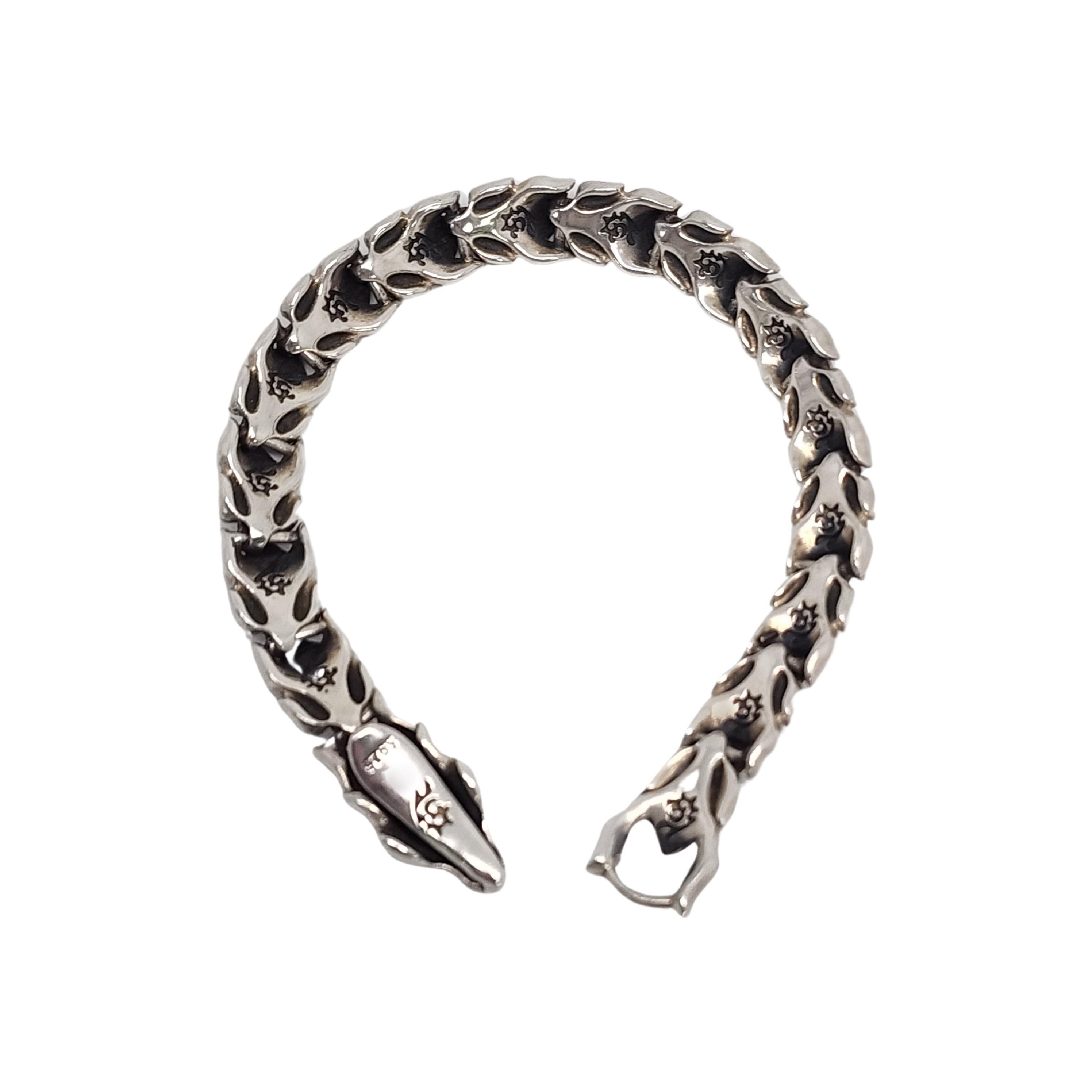 Sterling silver Dragon Scale unisex bracelet

Dragon head clasp with scale design bracelet. Squeeze the dragon hear to open the mouth clasp.

Measures approx 9