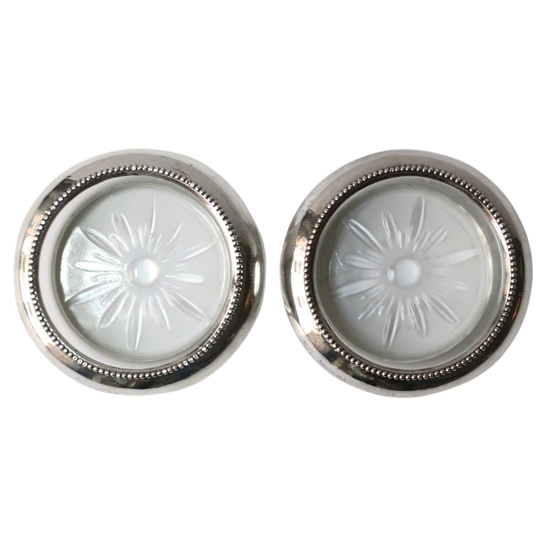 Des sous-verres à cocktail argent sterling