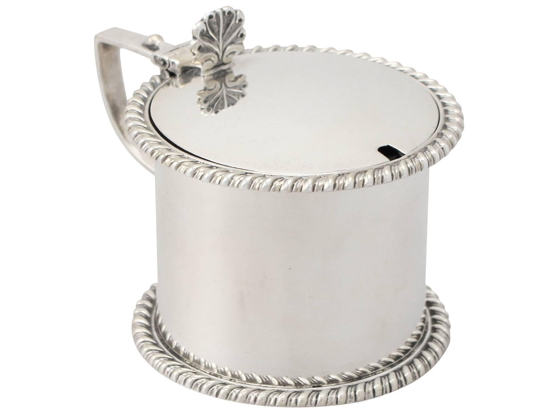 A fine antique Victorian English sterling silver drum mustard pot; an addition to our silver cruets / condiments collection.

This antique Victorian sterling silver mustard pot has a plain cylindrical drum shaped form.

The upper rim and base