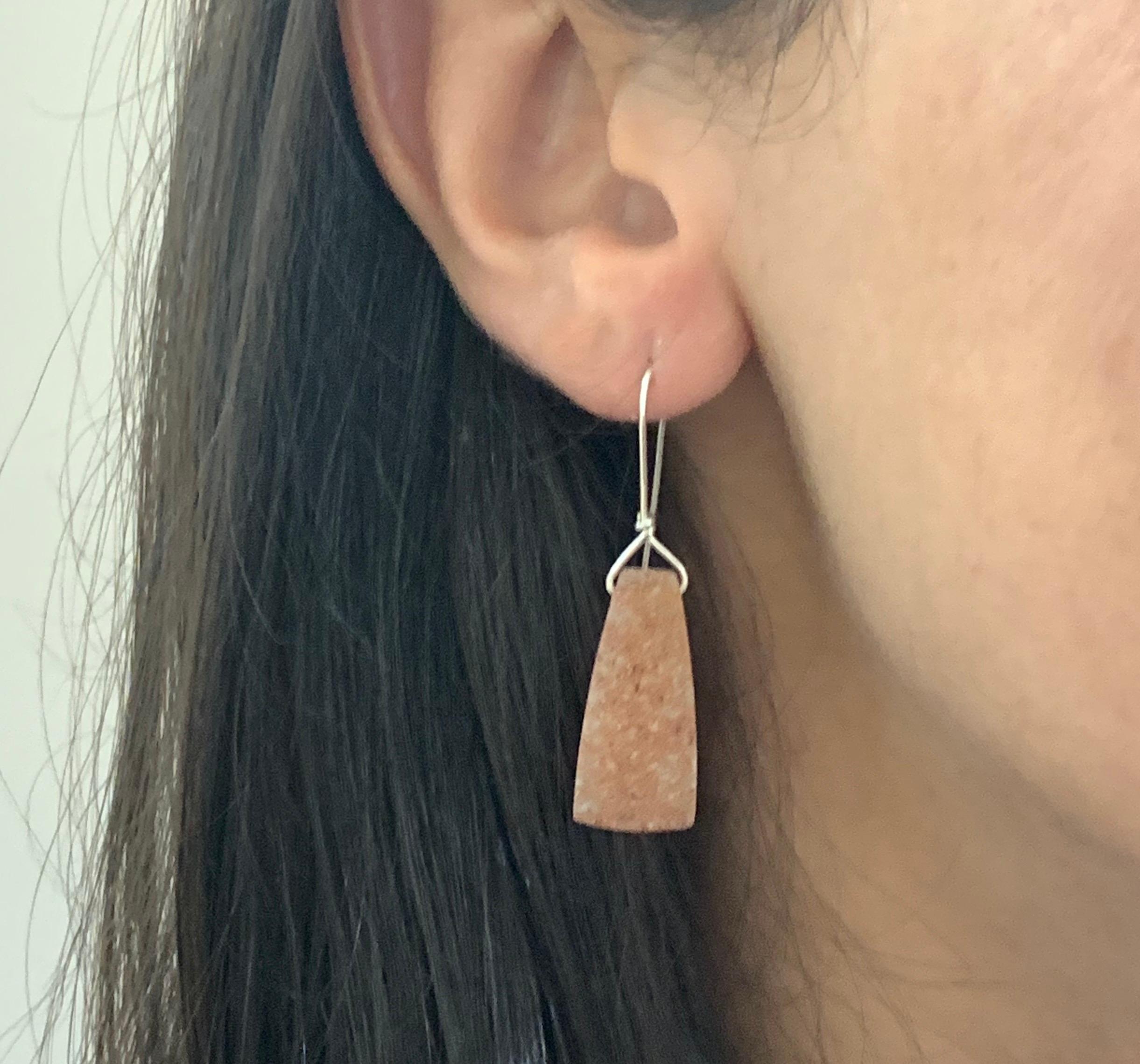 A stunning piece, these Druzy stones are a perfect match in quality and color. These earrings will have all eyes on you!

Material: Sterling Silver
Center Stone Details: Two Pear Shaped Druzys