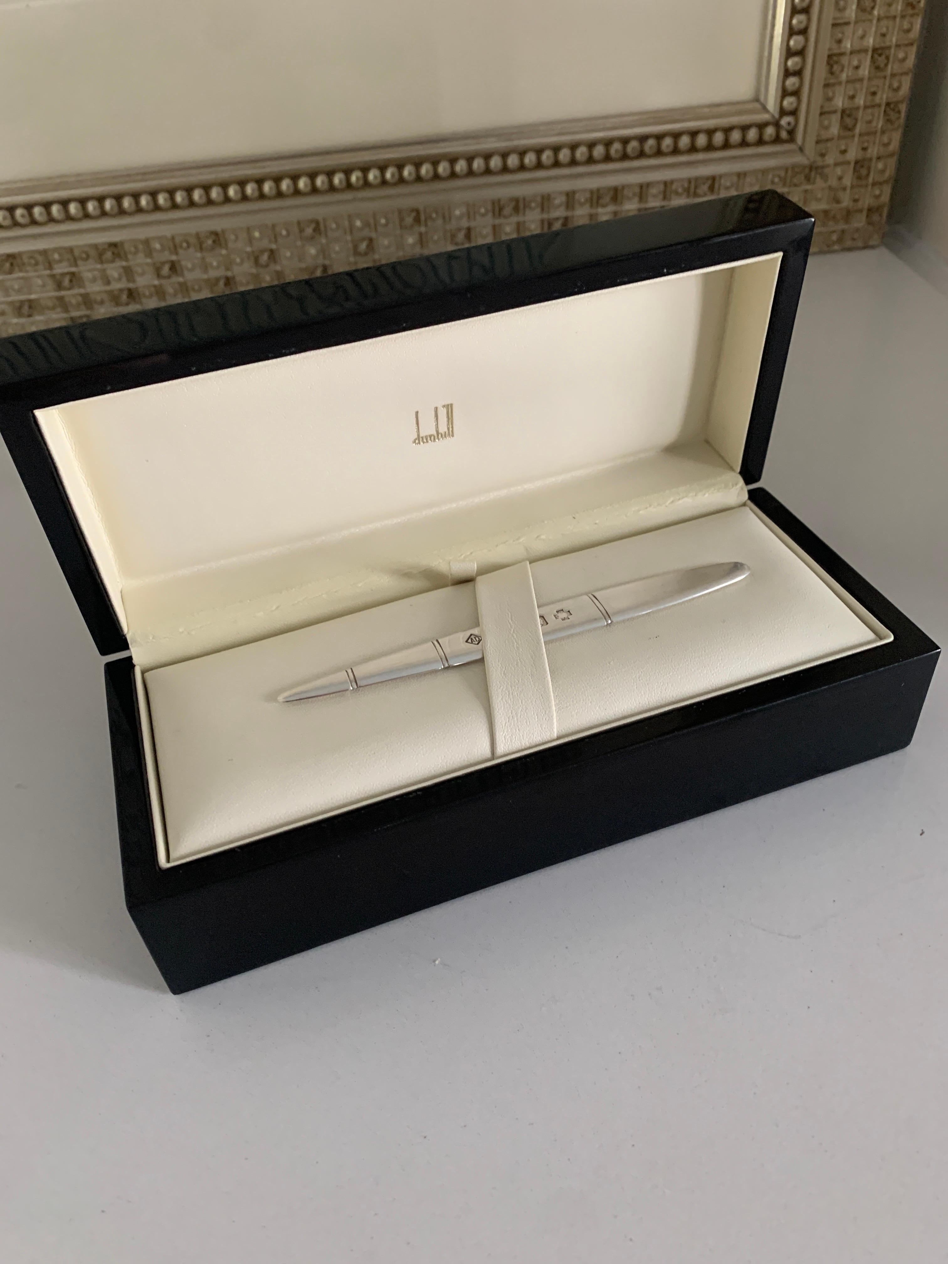 A wonderful and simply elegant Dunhill Letter opener of Sterling Silver. The piece has the Dunhill logo in small and very sophisticated lettering and placement. The box is clean and a wonderful presentation piece. Clearly more came in the box based