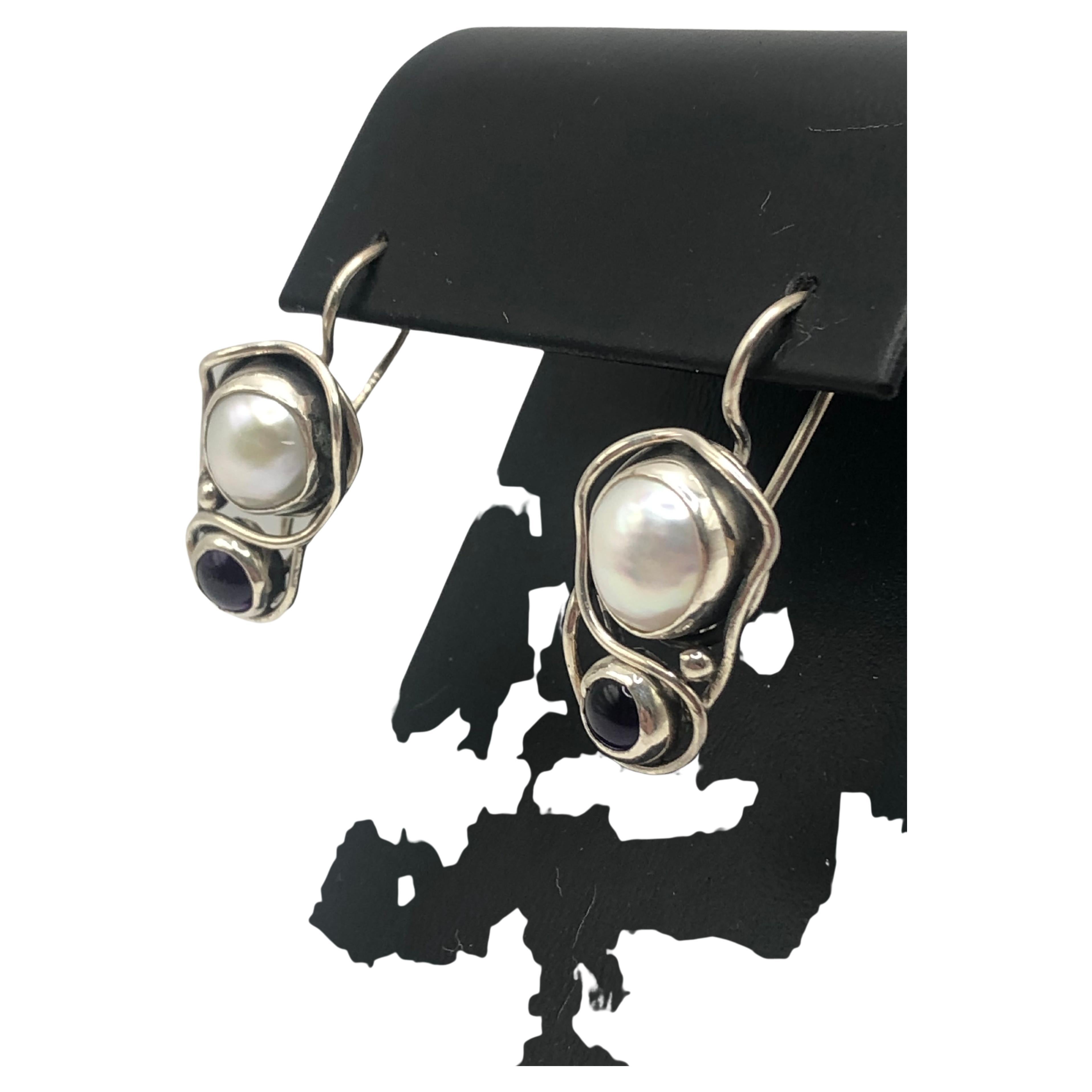 Handmade Earrings
Materials used: Organic Sterling Silver
Freshwater Pearl
Garnet 
in organic sterling silver setting 
One of piece 
$ USD 250 with free world shipping
Weight: 7.2 g 