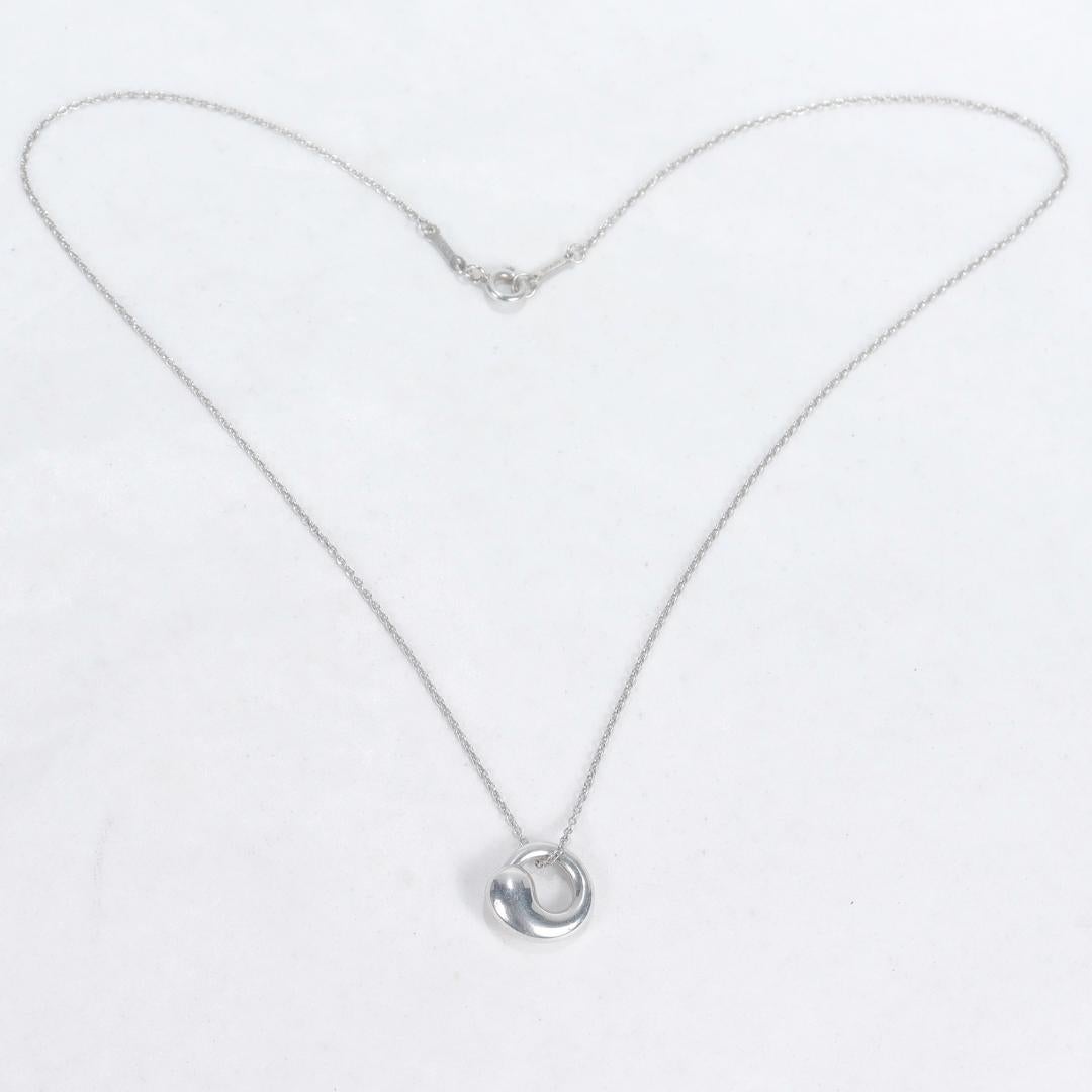 A fine silver pendant necklace.

By Elsa Peretti for Tiffany & Co.

In the form of a circle - the shape that is entirely complete & eternal.

Simply a wonderful necklace by Tiffany & Co.!

Date:
Late 20th or Early 21st Century

Overall Condition:
It