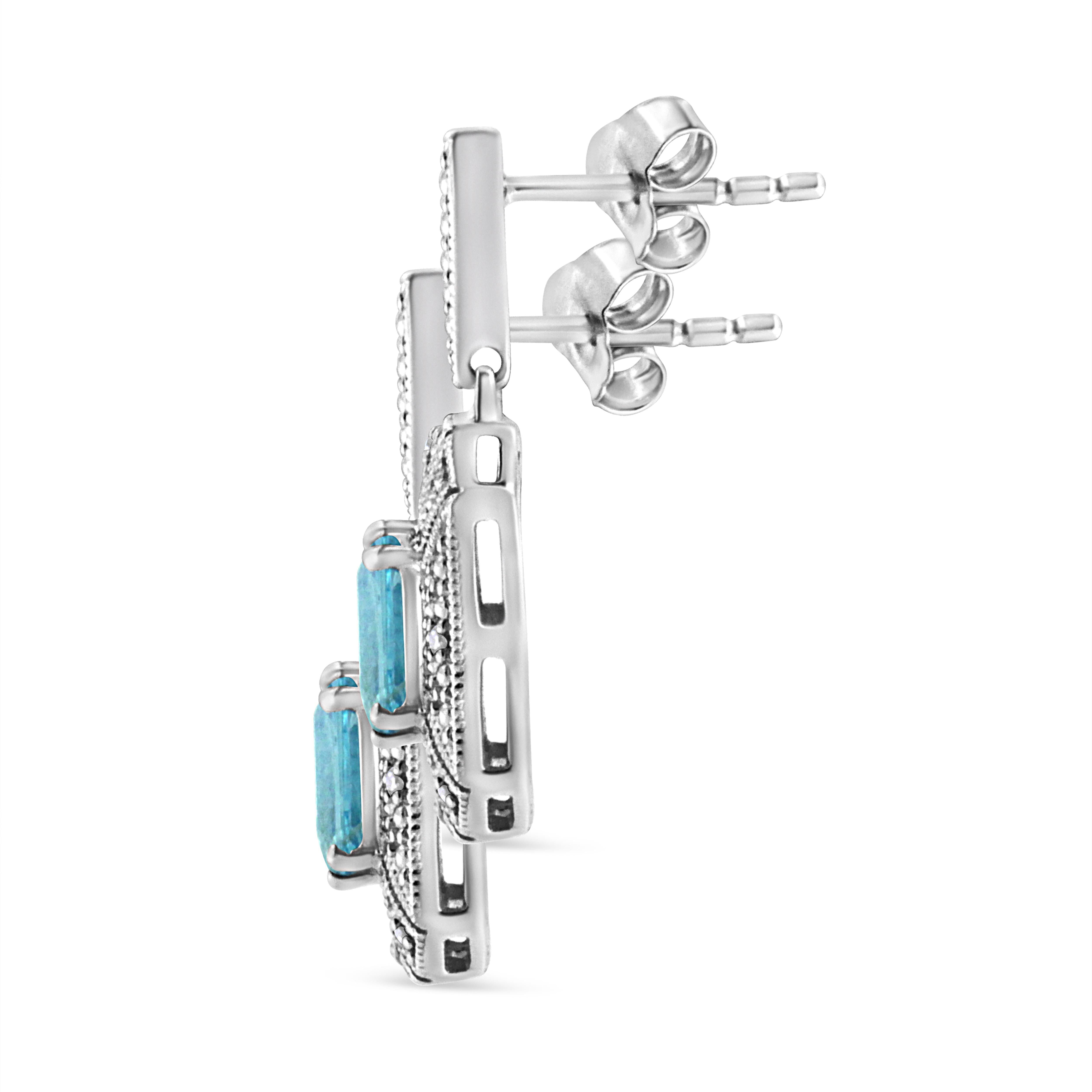 You won't regret adding these show stopper art deco drop and dangle .925 sterling silver earrings to your collection! An intricate design of silver beads surround a drop dead gorgeous 7x5MM emerald shape blue topaz at the center of each earring.