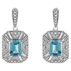 Boucles d'oreilles pendantes en argent sterling avec topaze bleue émeraude et accentuation de diamants