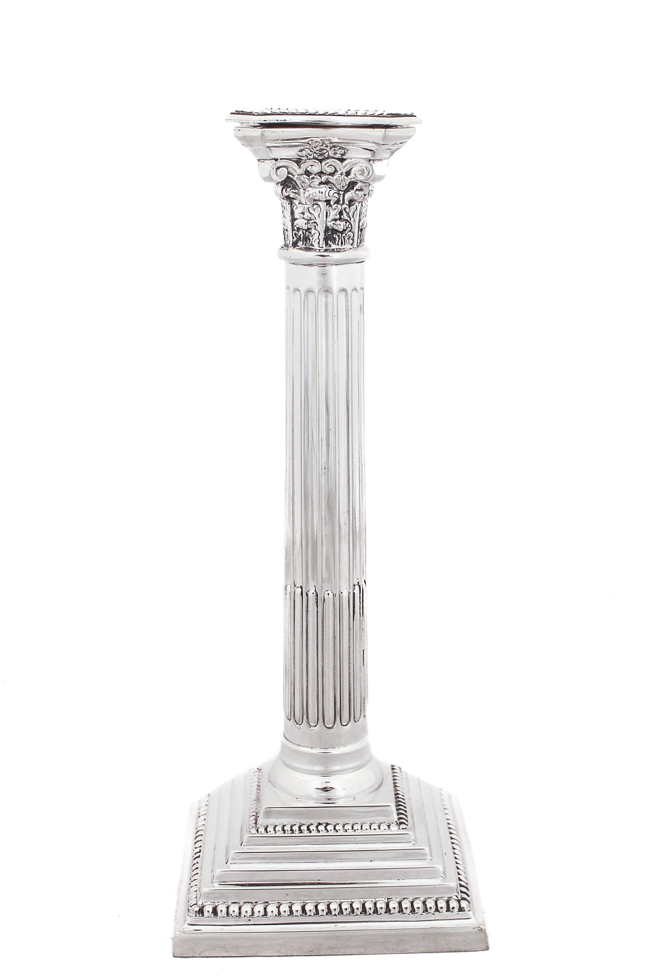 Being offered is a pair of sterling silver candlesticks made in London, England in 1956.  They are designed in the neoclassical style, Corinthian to be exact.  The word 