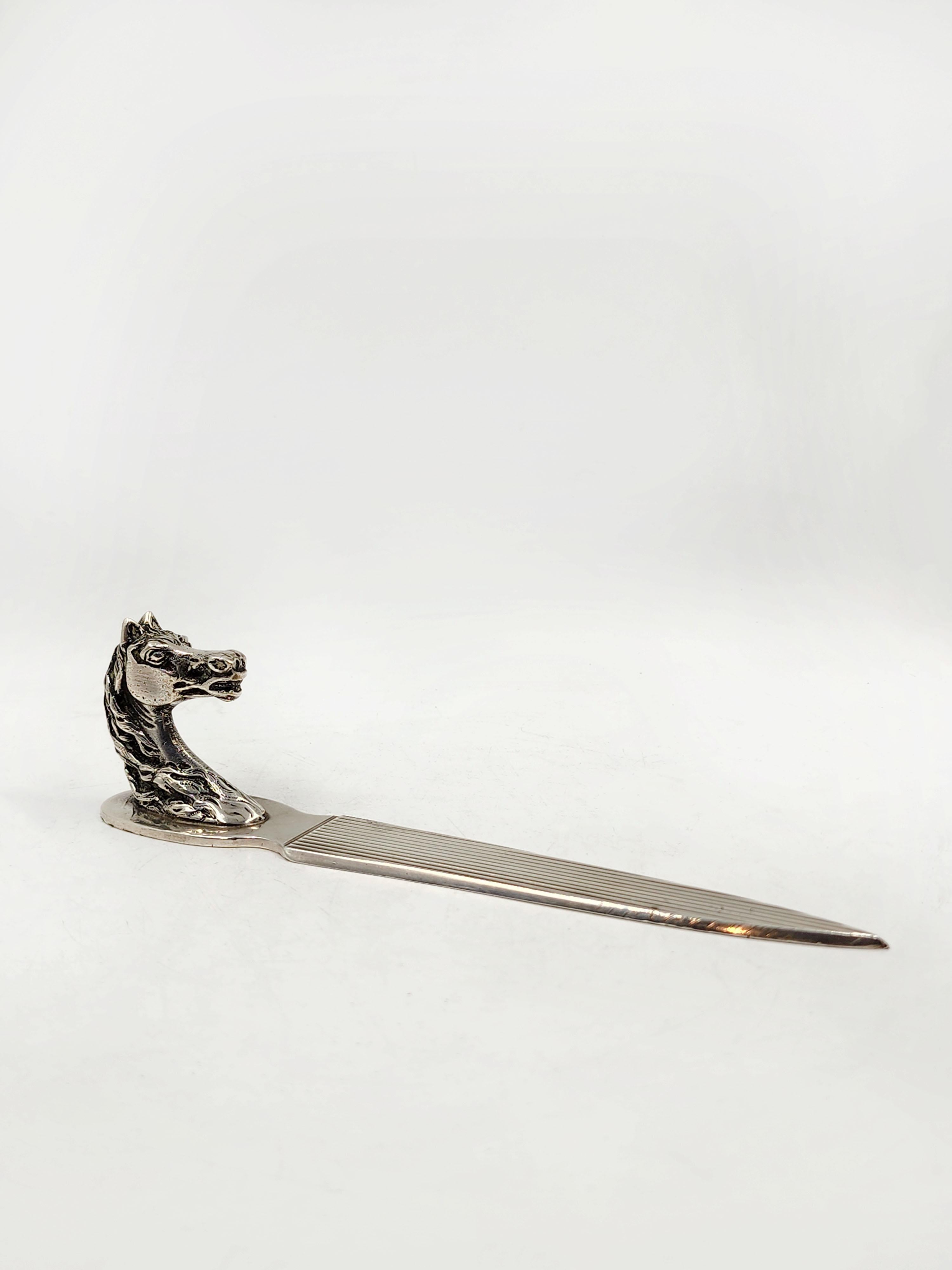 Sterling Silver Equestrian Letter Opener by Hermes Paris
Beautiful letter opener with a horse head handle and decorated with vertical lines towards the tip, signed on the bottom.
Measures:
Height: 5 centimeters
Length: 20.5 centimeters
Depth: 3